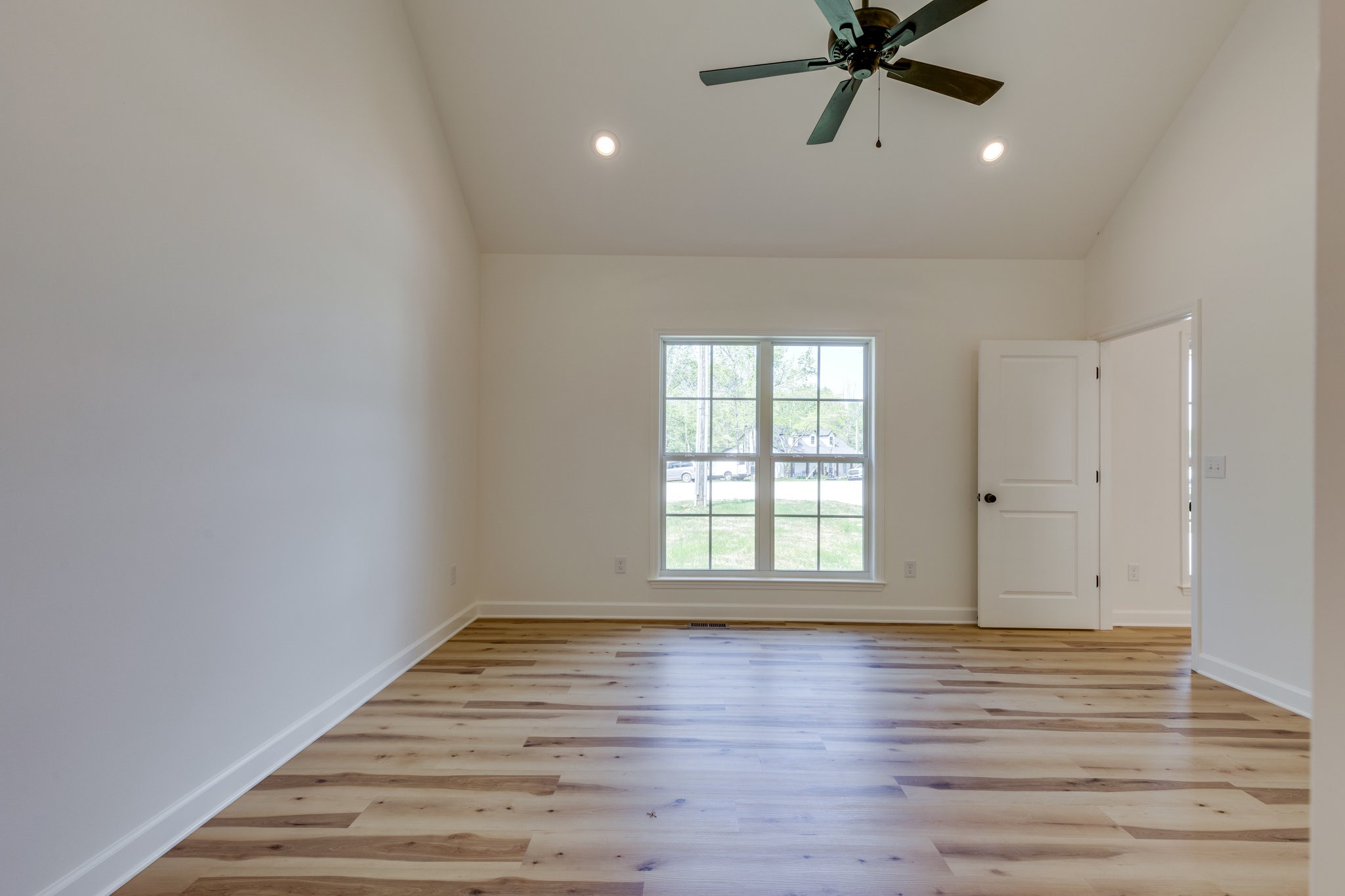 309 Pisgah Rdg Cove Pulaski, TN 38478 - Photo 15 of 43 wooden floor in an empty room with a window