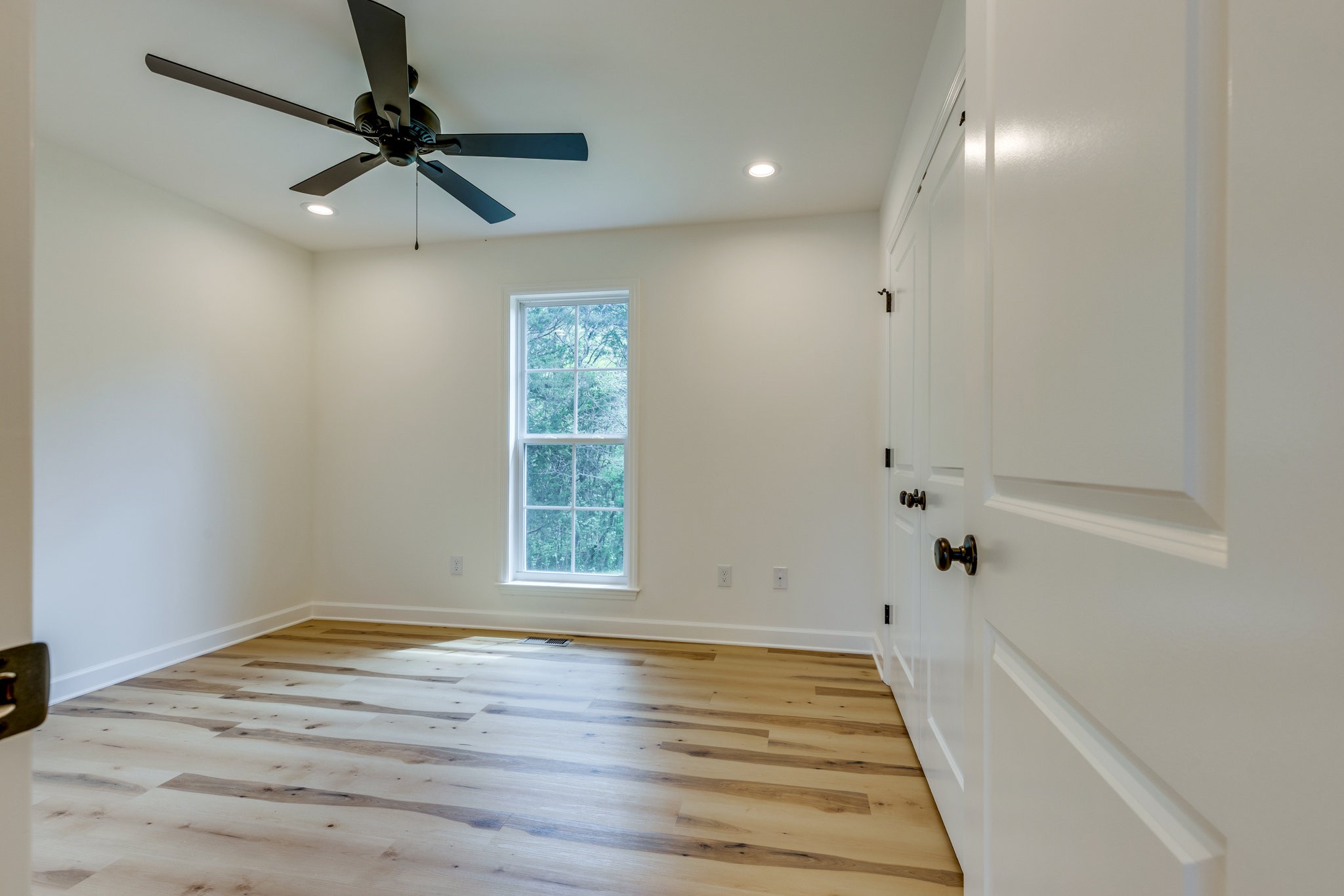 309 Pisgah Rdg Cove Pulaski, TN 38478 - Photo 22 of 43 wooden floor in an empty room with a window