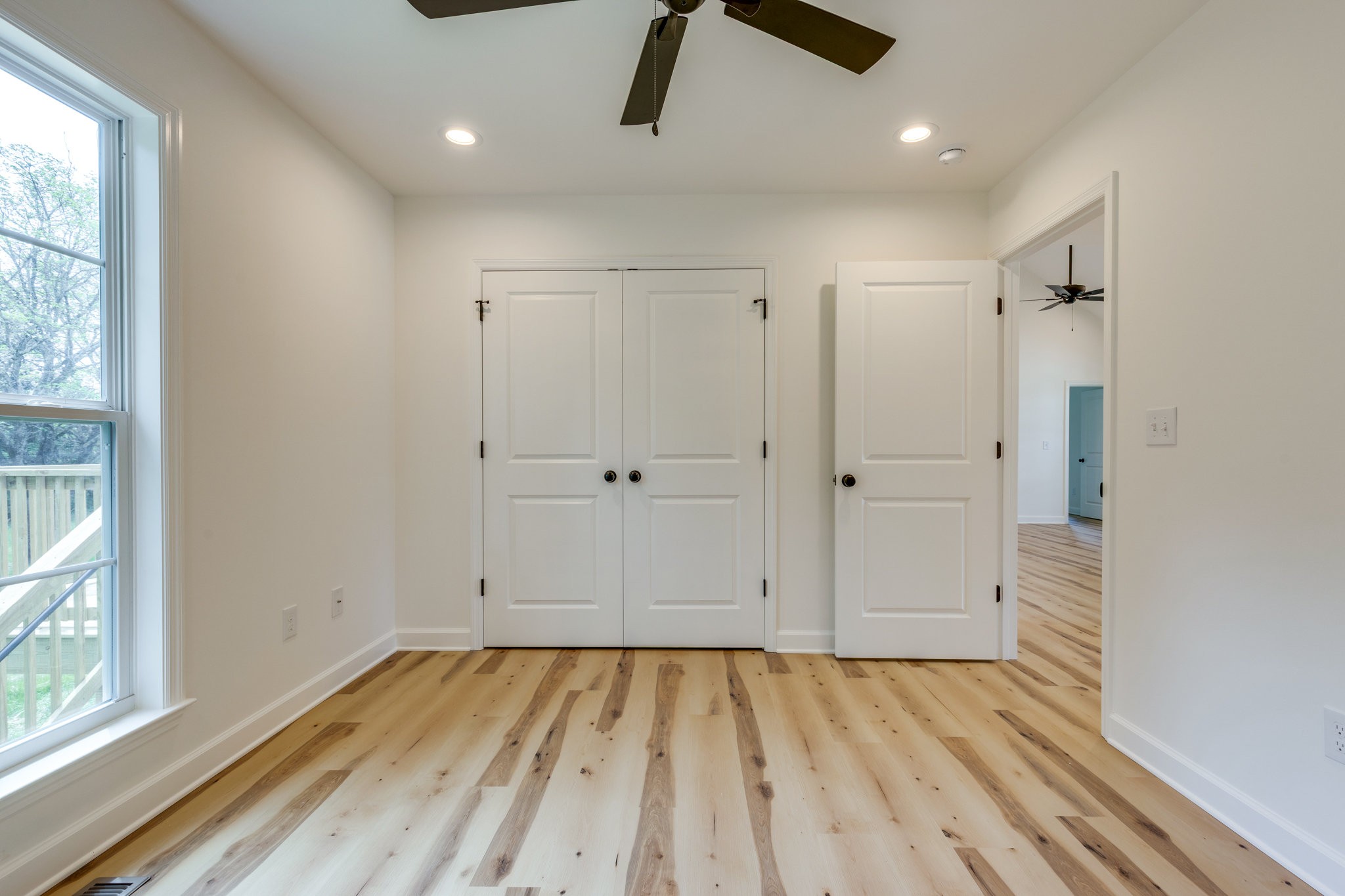 309 Pisgah Rdg Cove Pulaski, TN 38478 - Photo 23 of 43 an empty room with wooden floor and windows