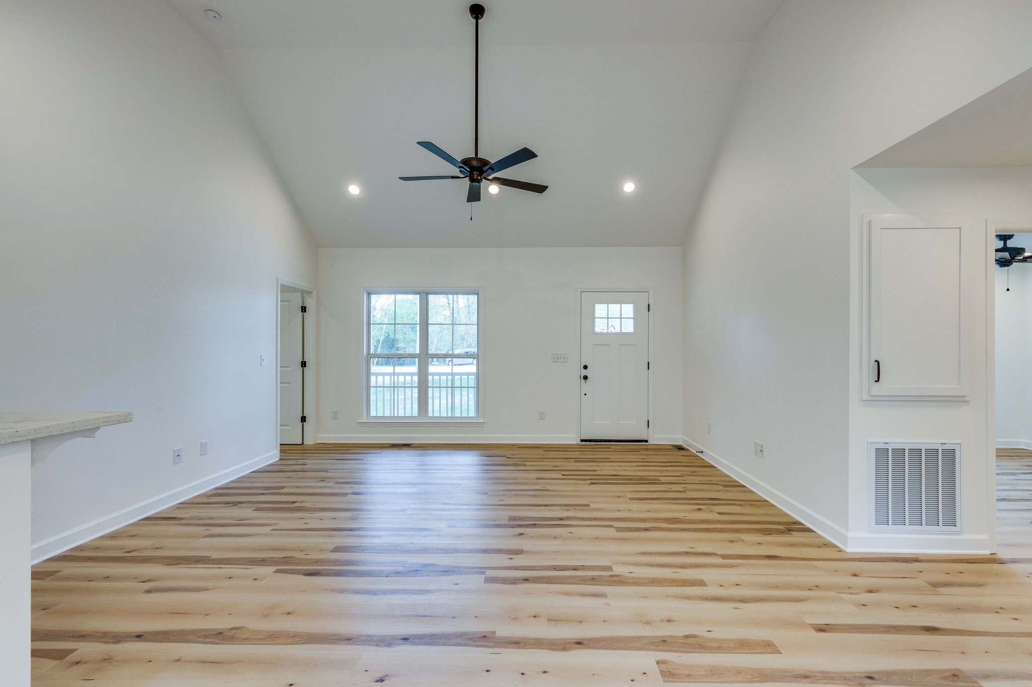 309 Pisgah Rdg Cove Pulaski, TN 38478 - Photo 4 of 43 a view of an empty room with window and wooden floor