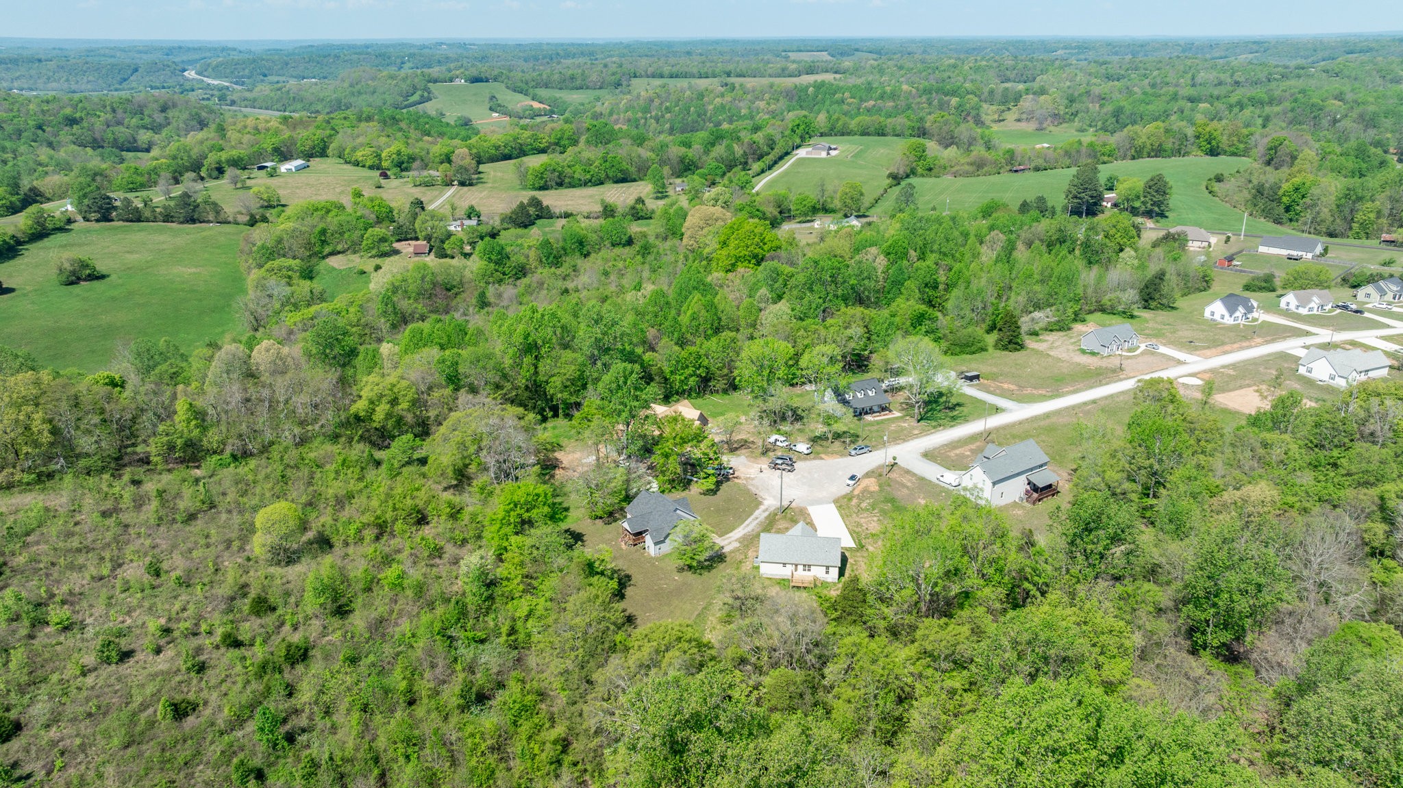 309 Pisgah Rdg Cove Pulaski, TN 38478 - Photo 42 of 43 an aerial view of residential houses with outdoor space and trees
