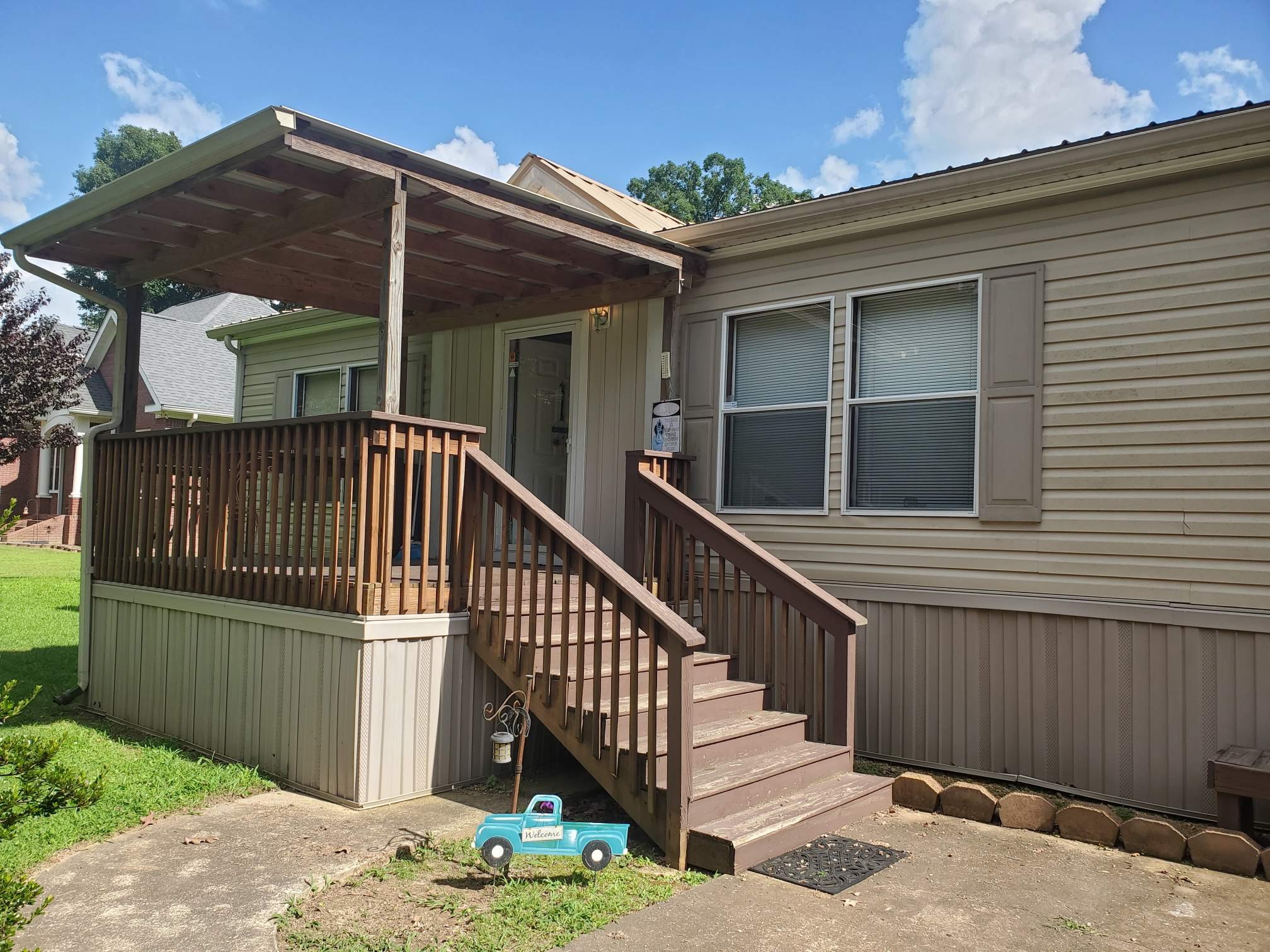 a view of a house with wooden fence