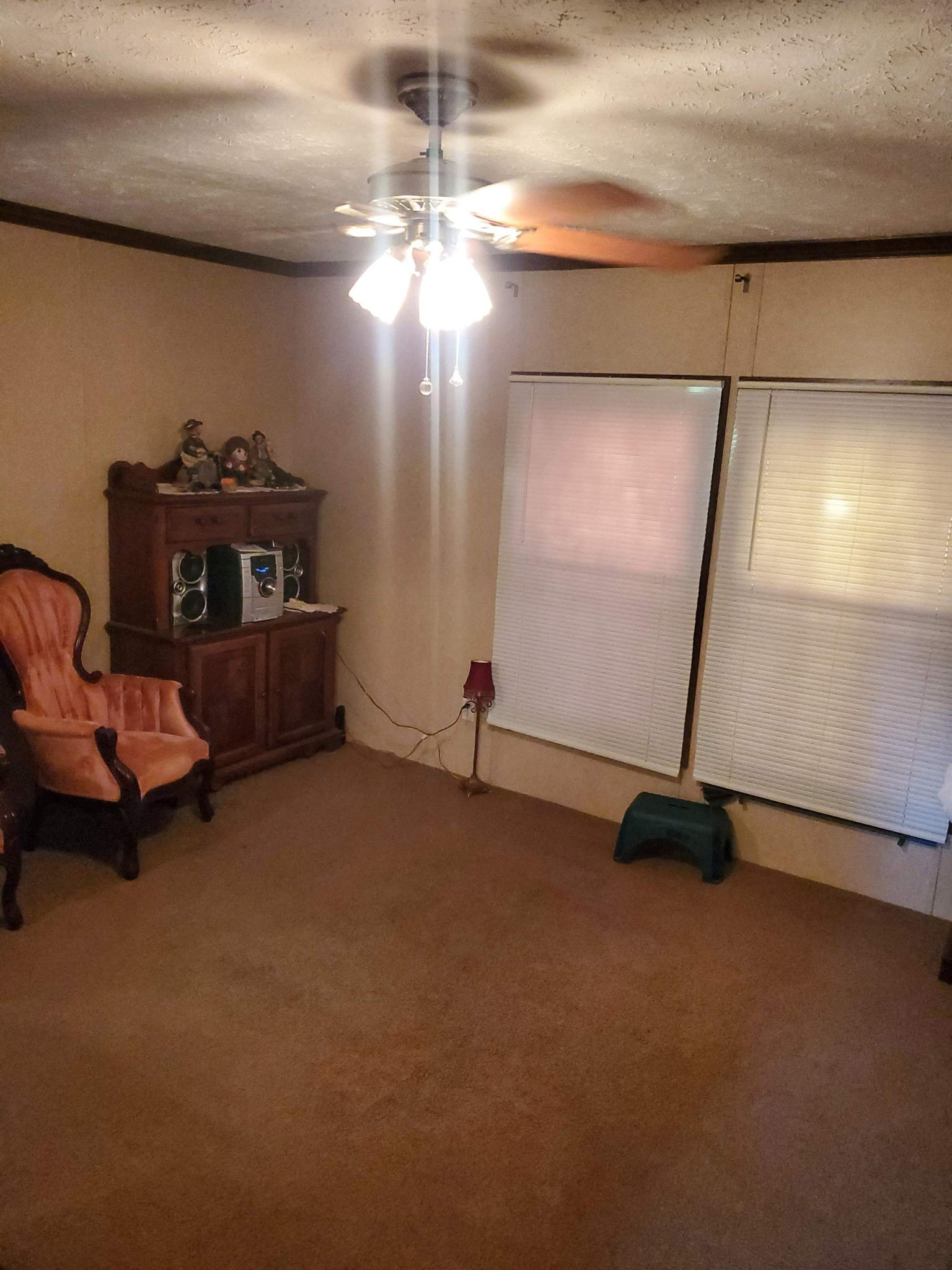 411 West Martin Road Collinwood, TN 38450 - Photo 15 of 23 a room with gym equipment and a chandelier