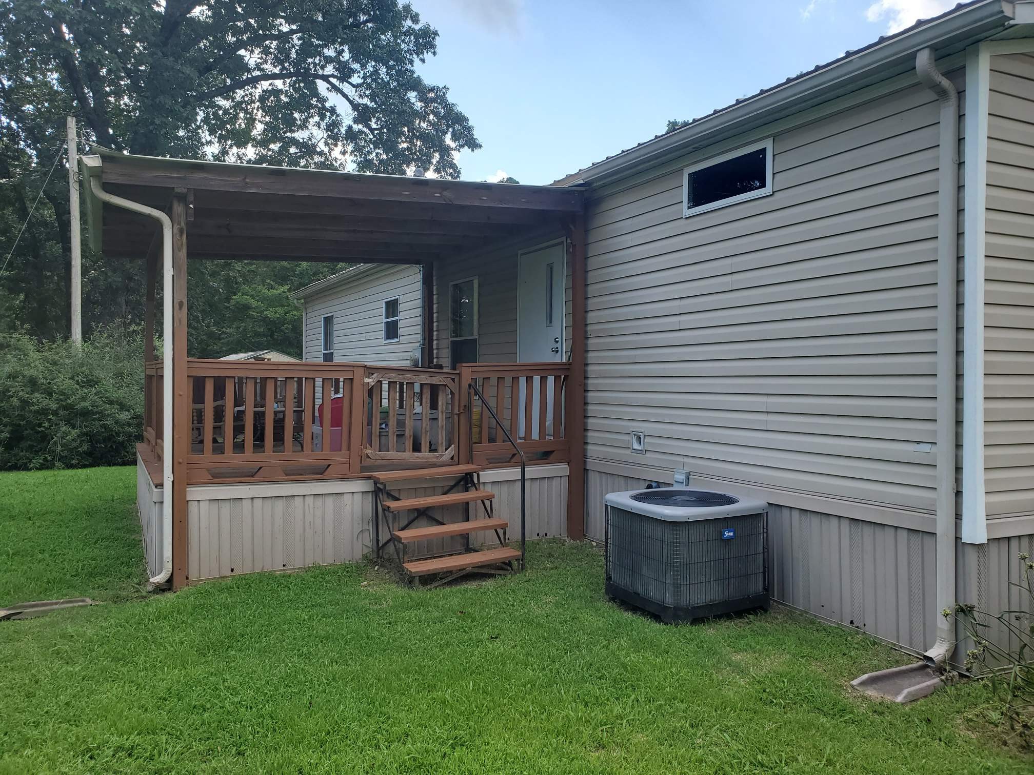411 West Martin Road Collinwood, TN 38450 - Photo 22 of 23 a view of house with backyard and porch