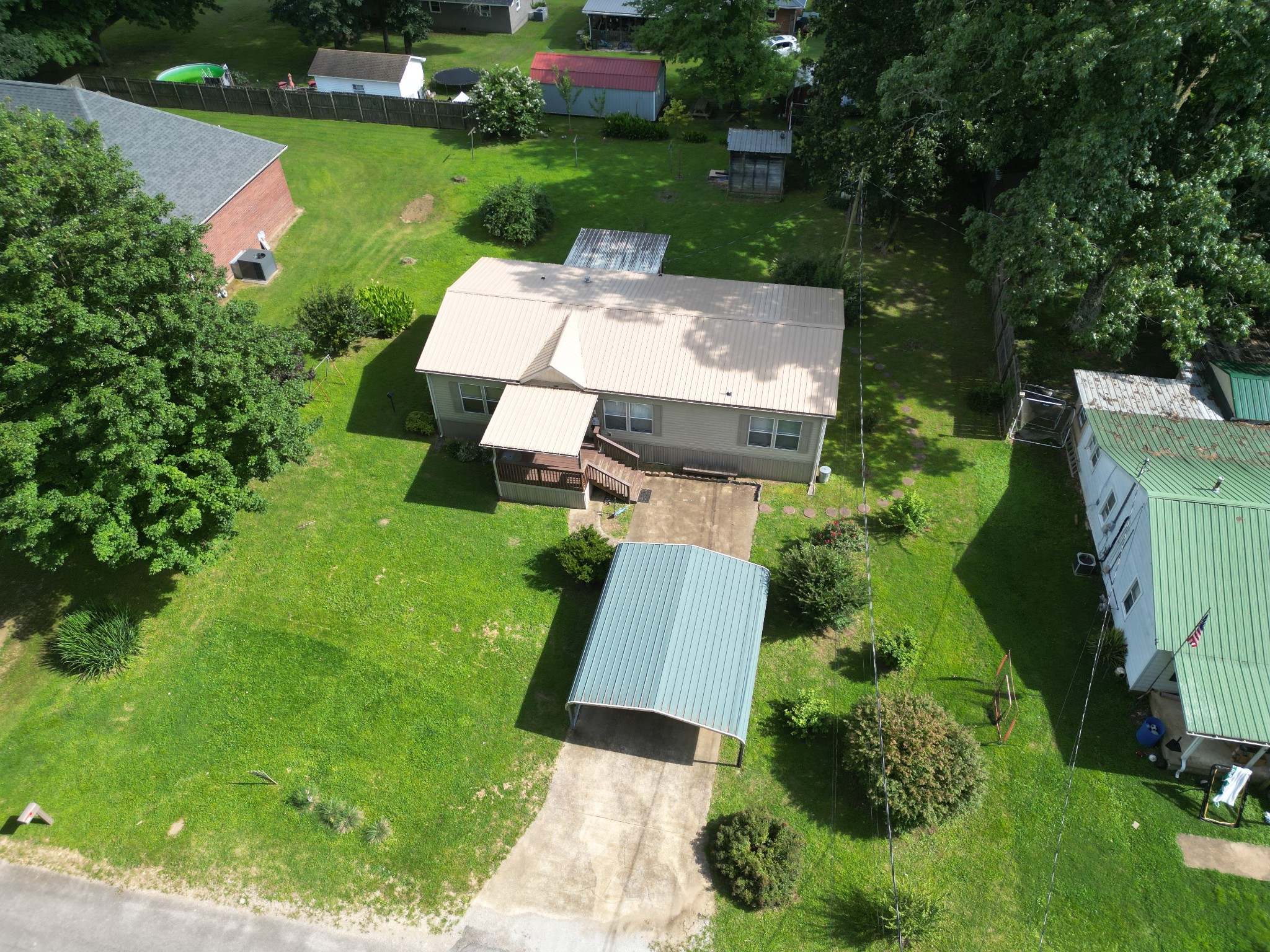 411 West Martin Road Collinwood, TN 38450 - Photo 4 of 23 an aerial view of a house with garden space and street view