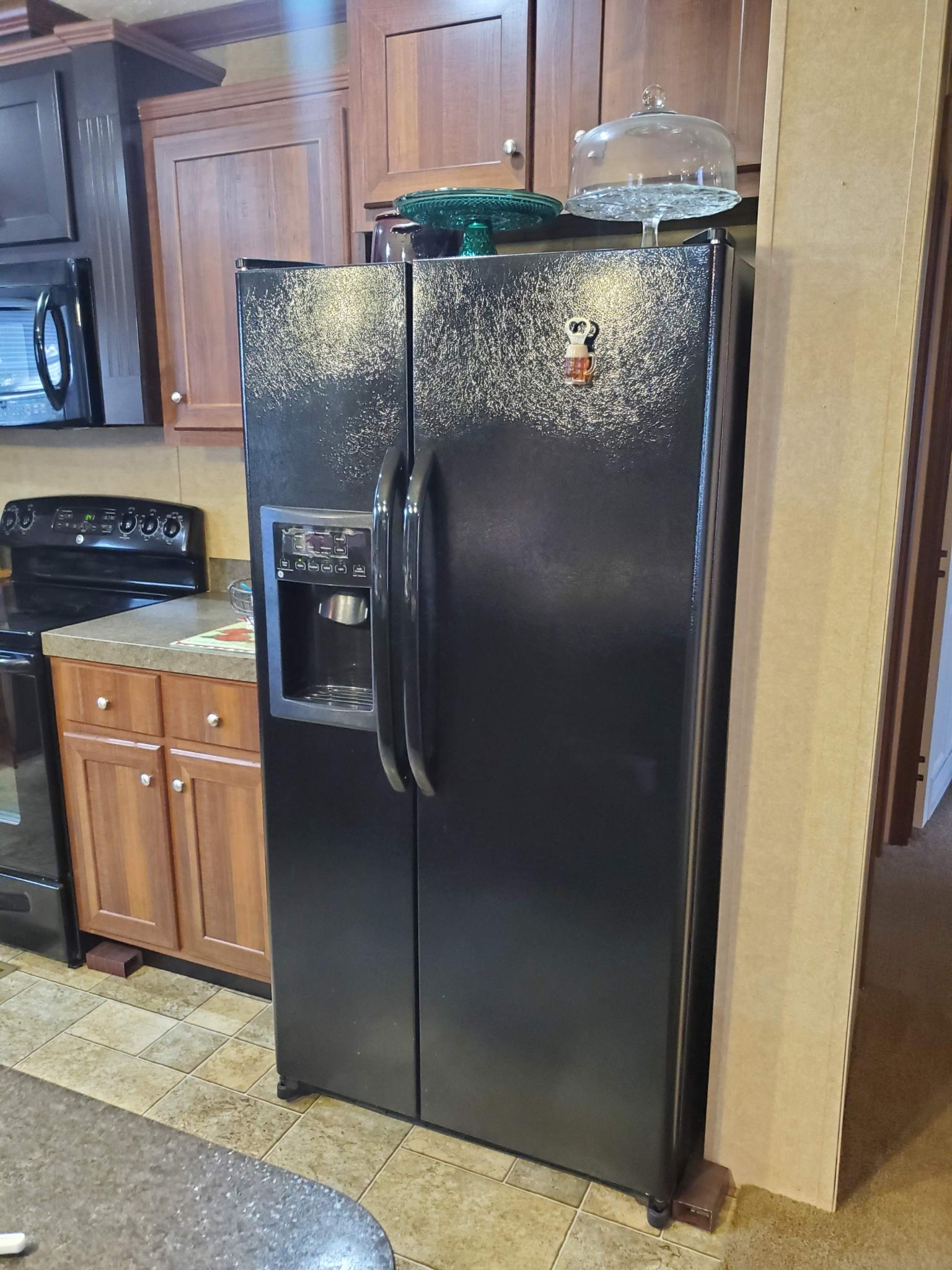 411 West Martin Road Collinwood, TN 38450 - Photo 10 of 23 a kitchen with a refrigerator and a stove