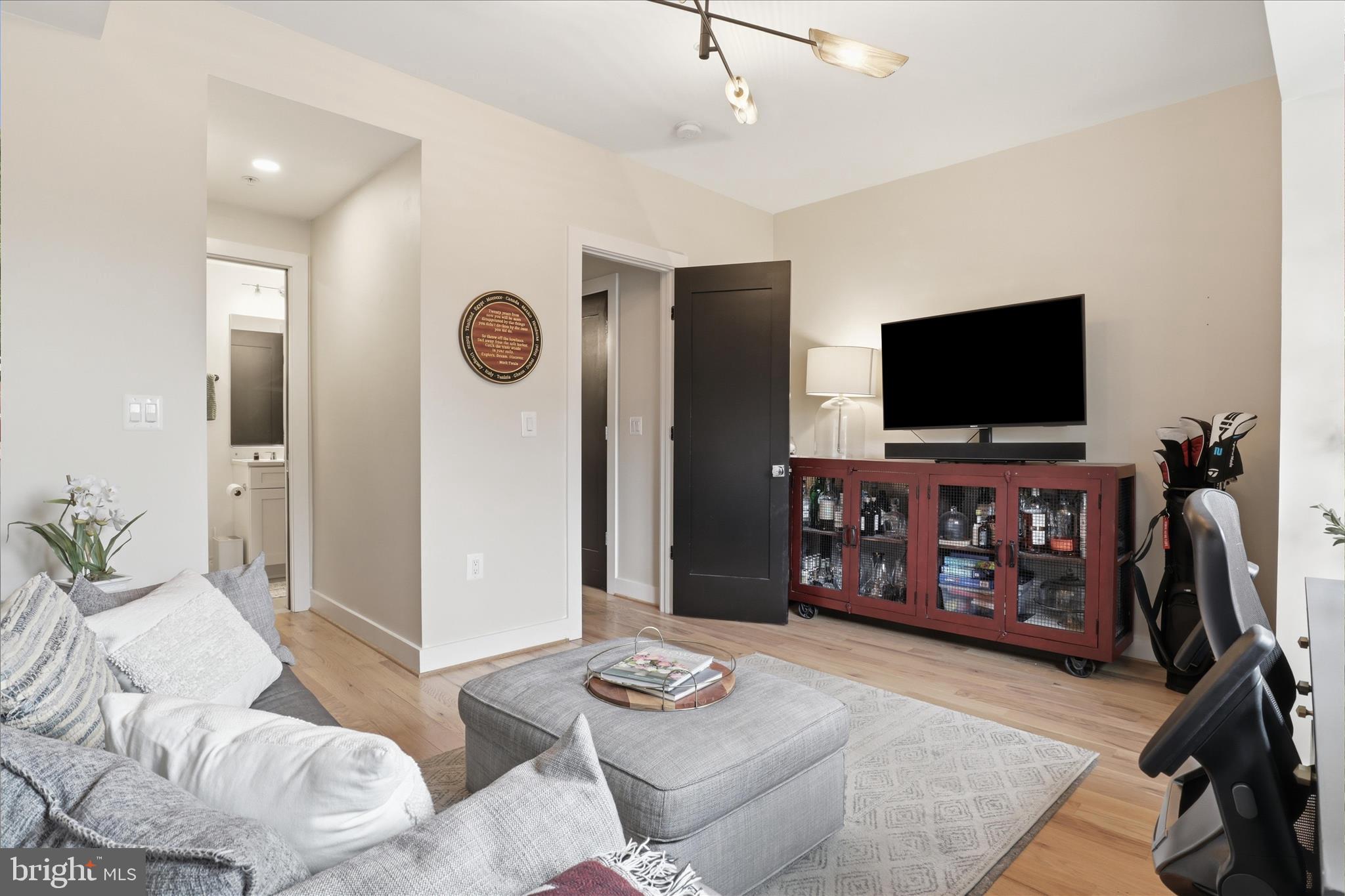 1222 Neal Street Northeast, Unit 3 Washington, DC 20002 - Photo 15 of 38 a living room with furniture and a flat screen tv