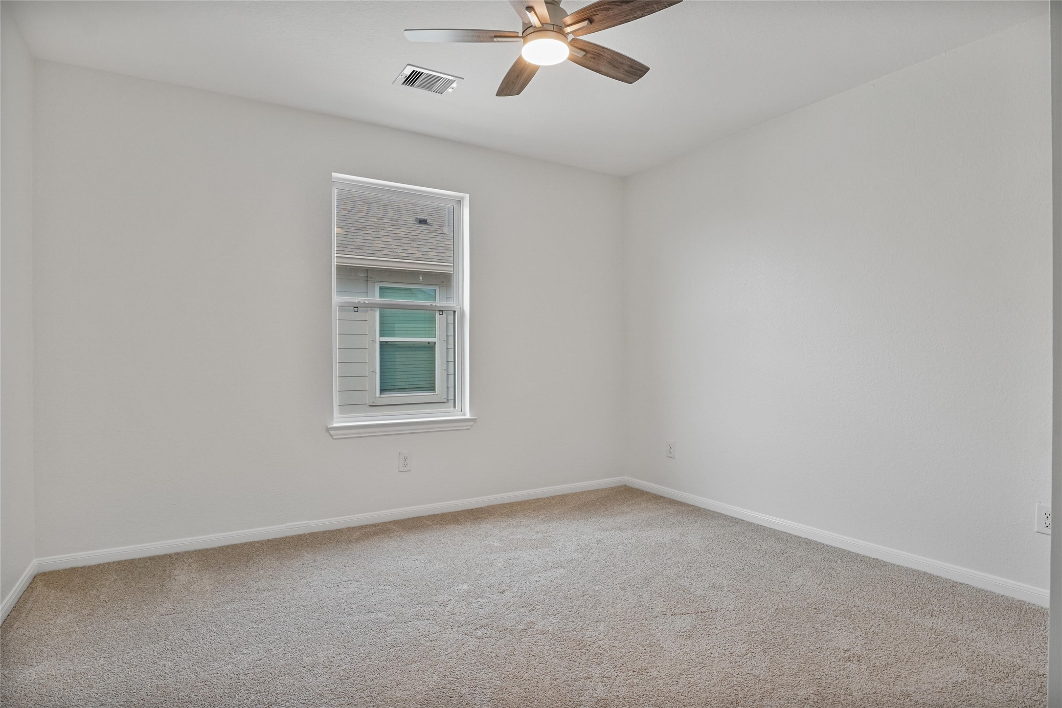10511 Kings River Drive Rosharon, TX 77583 - Photo 17 of 25 a view of an empty room with a window