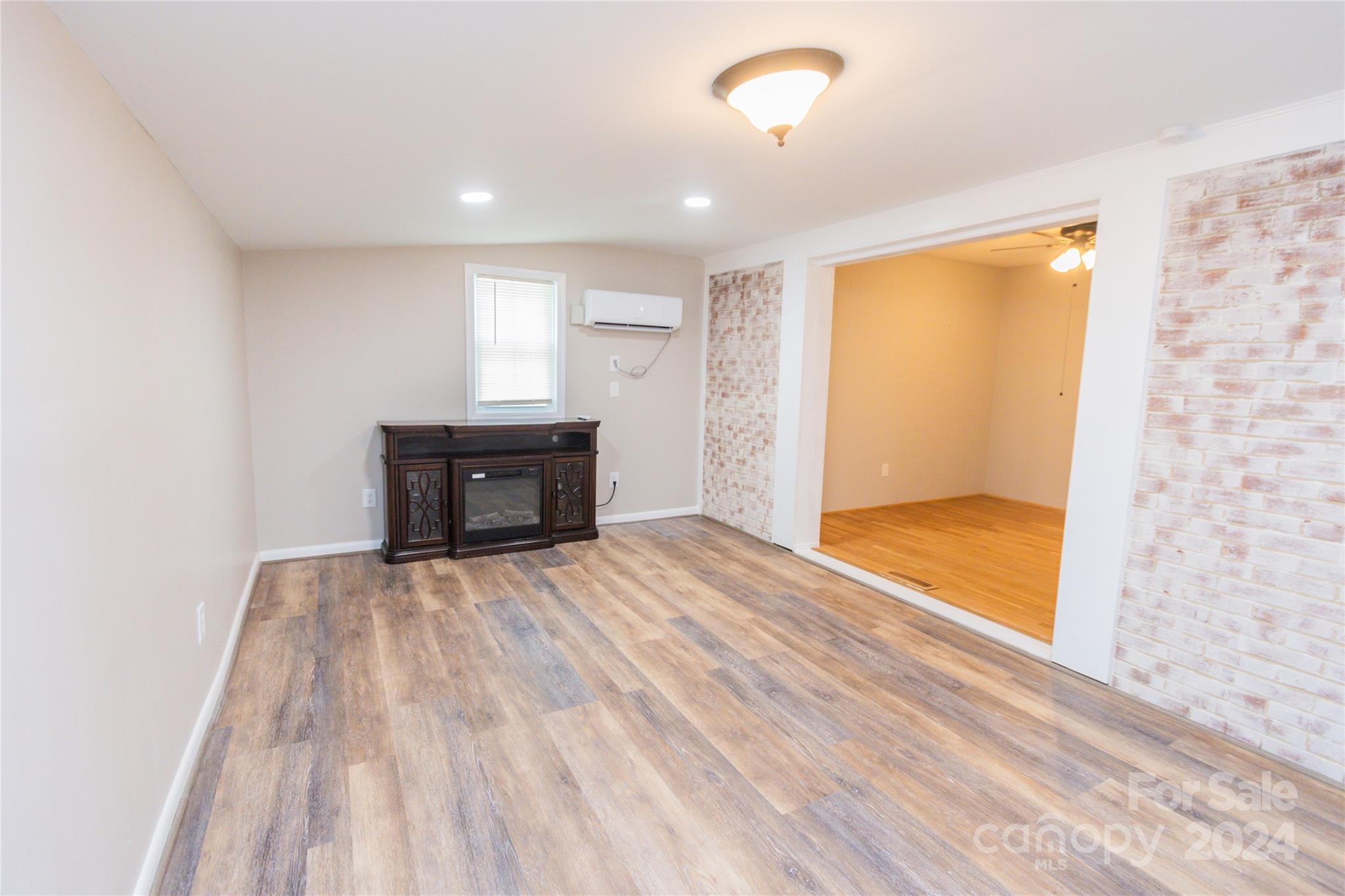 111 Colonial Avenue Lancaster, SC 29720 - Photo 16 of 40 a view of empty room with wooden floor and fan