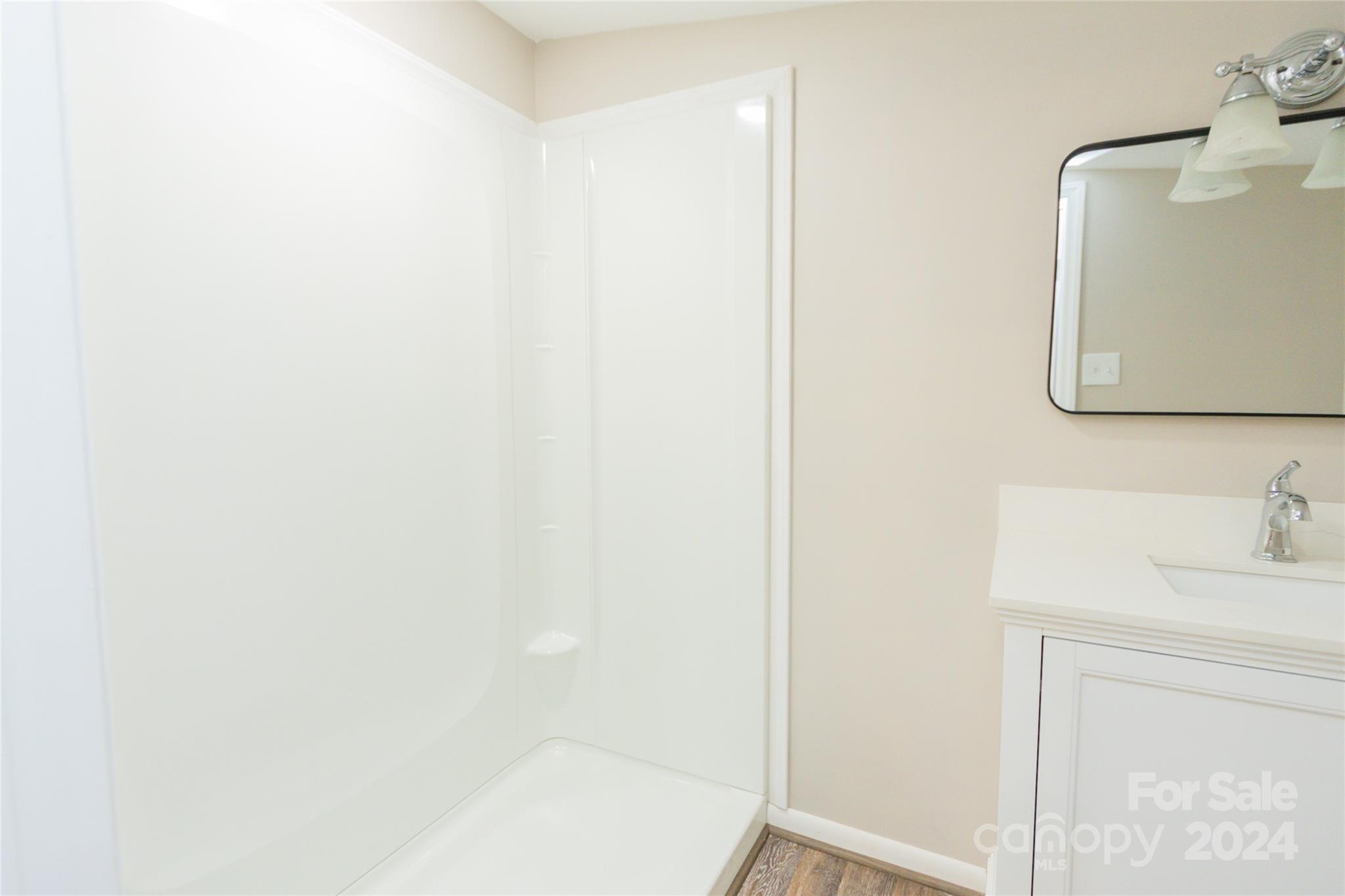 111 Colonial Avenue Lancaster, SC 29720 - Photo 17 of 40 a bathroom with a sink and a mirror