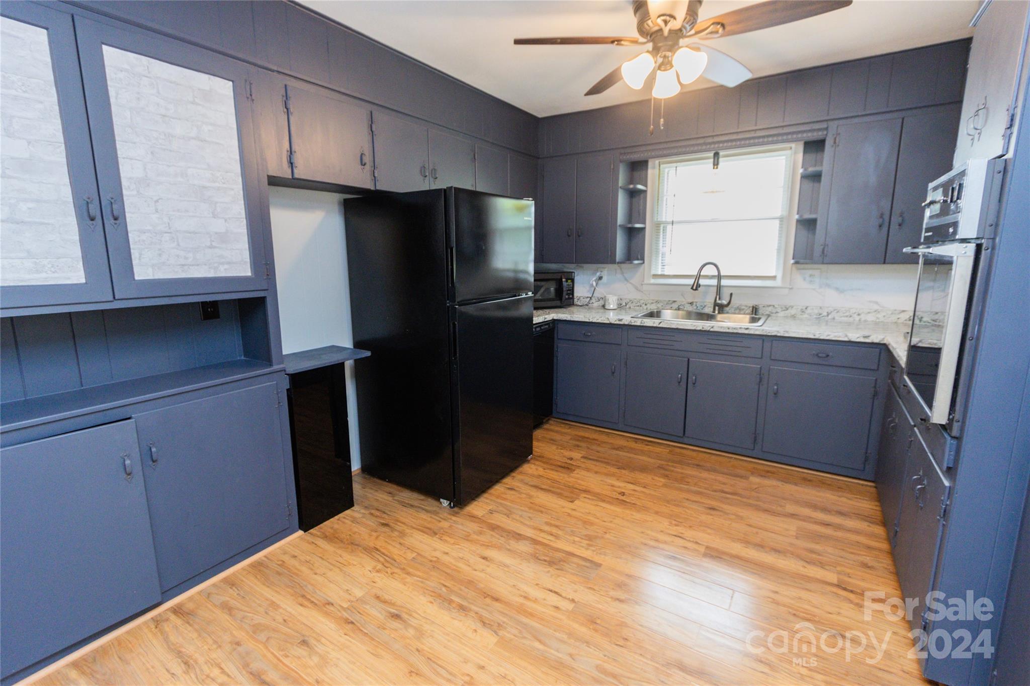 111 Colonial Avenue Lancaster, SC 29720 - Photo 2 of 40 a kitchen with stainless steel appliances granite countertop a sink stove and refrigerator