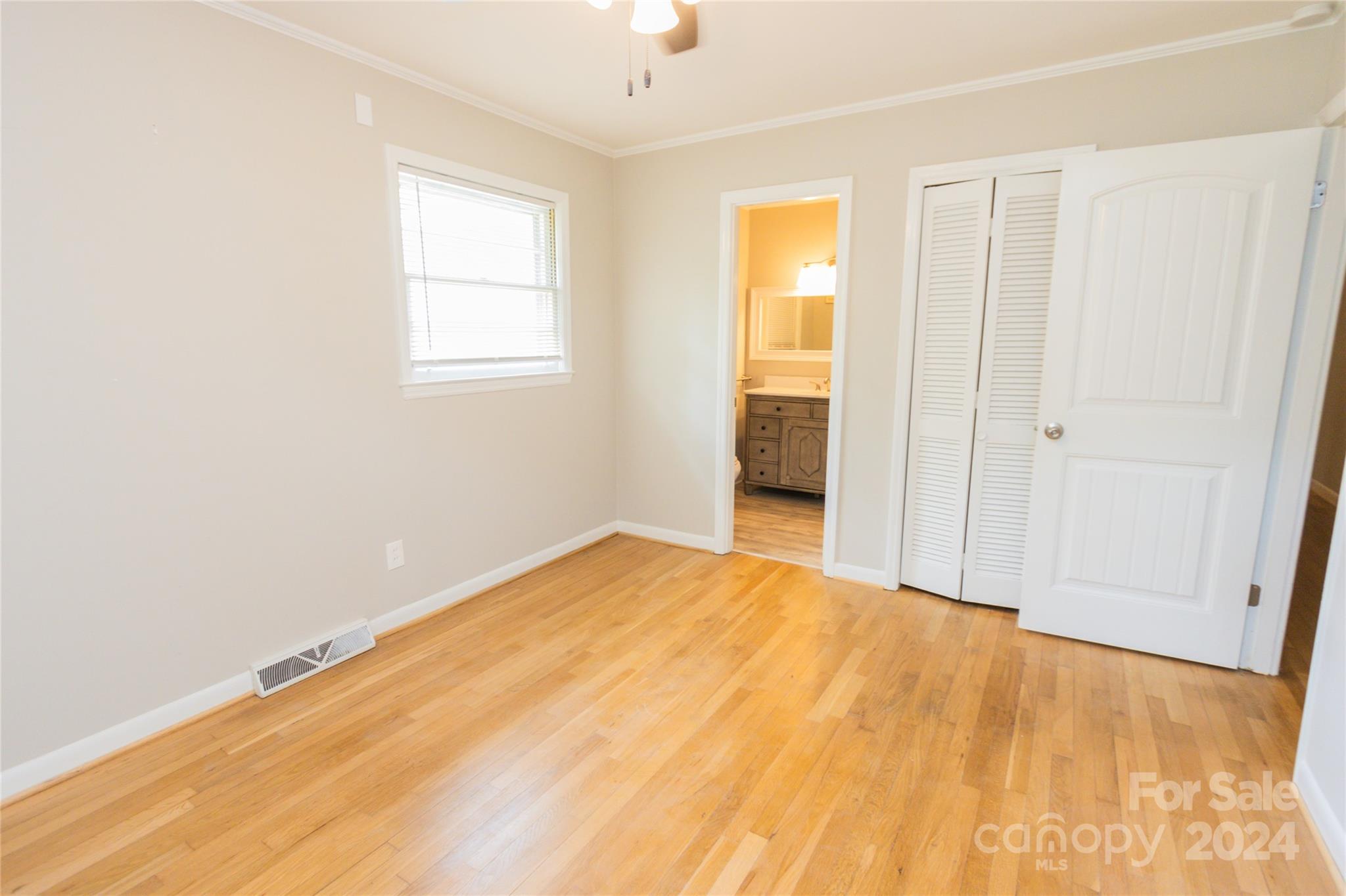 111 Colonial Avenue Lancaster, SC 29720 - Photo 25 of 40 a view of empty room with wooden floor and fan