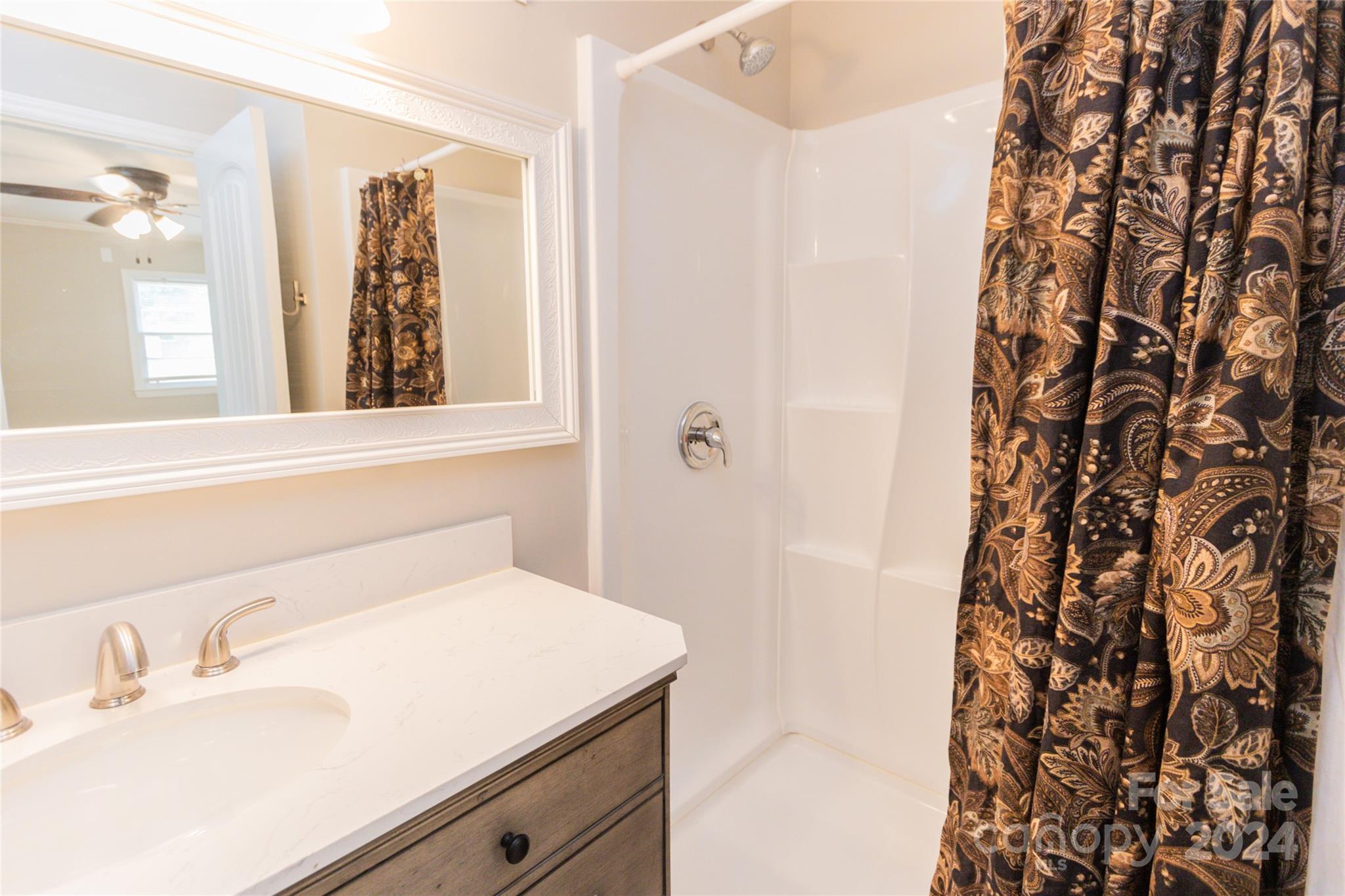 111 Colonial Avenue Lancaster, SC 29720 - Photo 27 of 40 a bathroom with a sink and a mirror