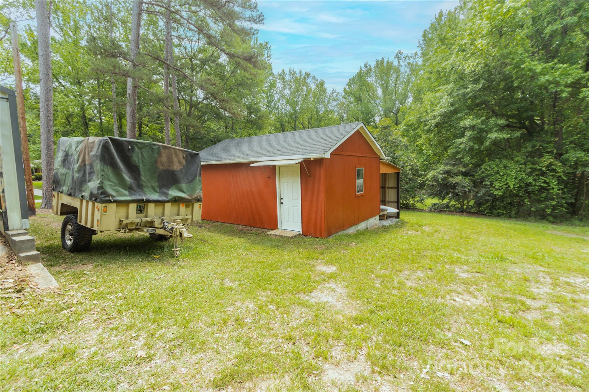 111 Colonial Avenue Lancaster, SC 29720 - Photo 33 of 40 a backyard of a house with yard and trampoline