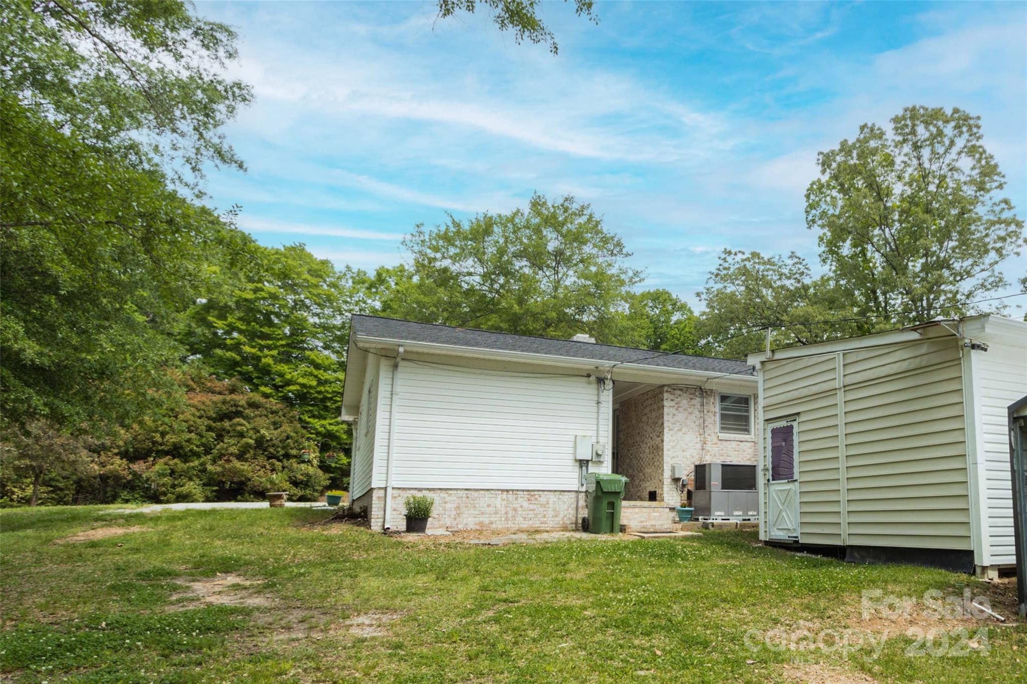 111 Colonial Avenue Lancaster, SC 29720 - Photo 35 of 40 a backyard of a house with yard and barbeque oven