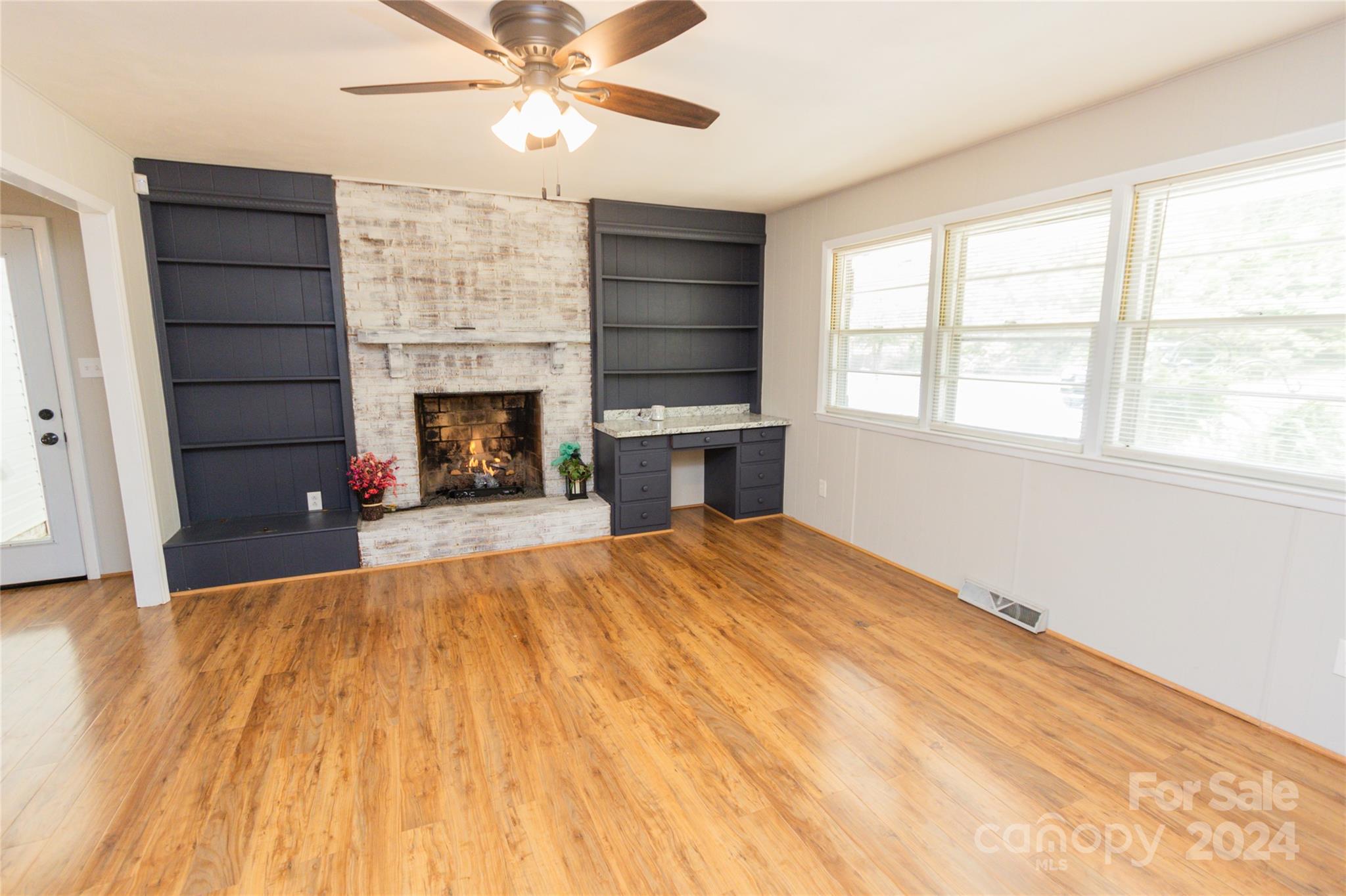 111 Colonial Avenue Lancaster, SC 29720 - Photo 6 of 40 a bedroom with a bed and a fireplace