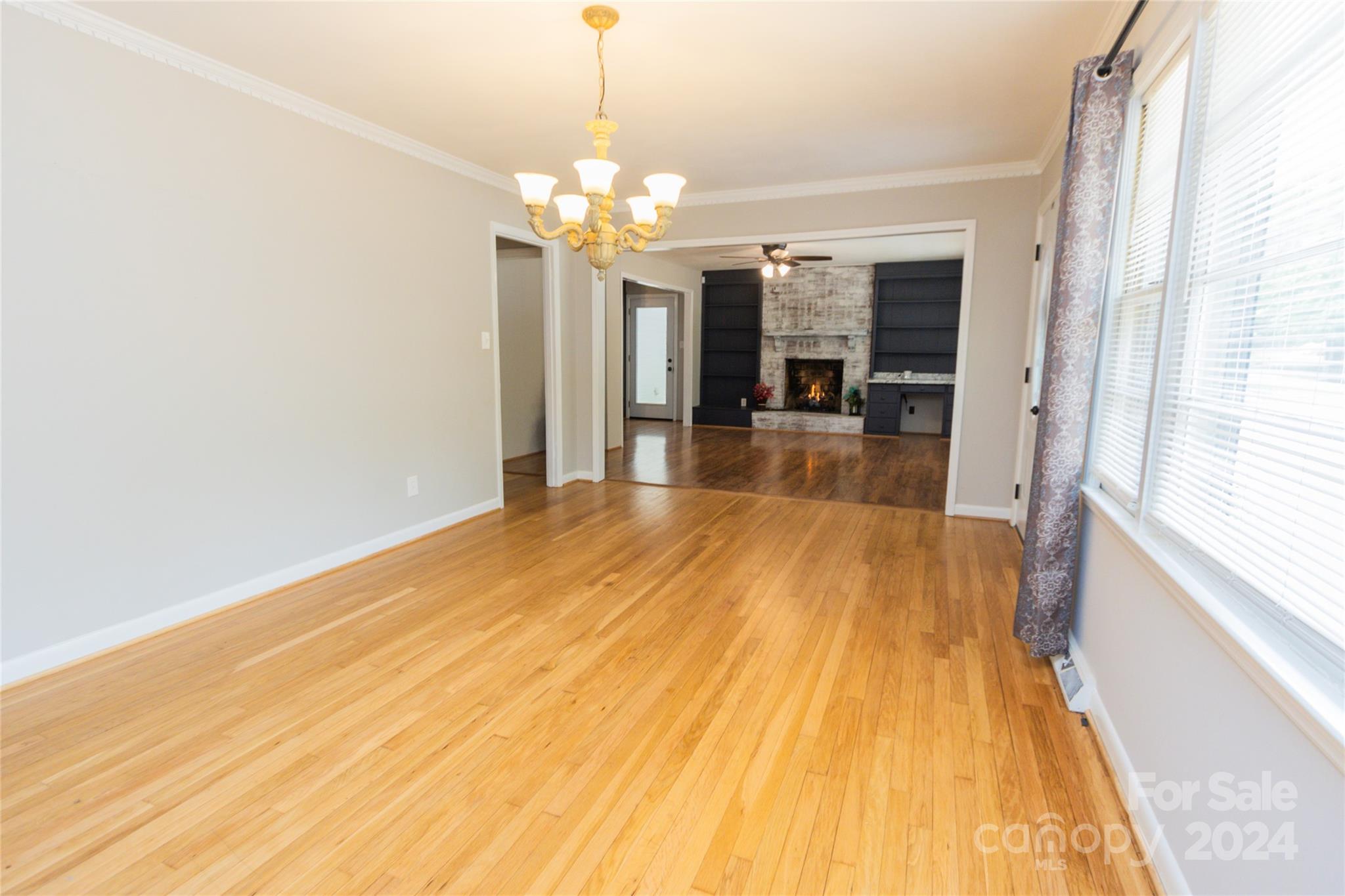 111 Colonial Avenue Lancaster, SC 29720 - Photo 10 of 40 a view of a room with wooden floor and large windows