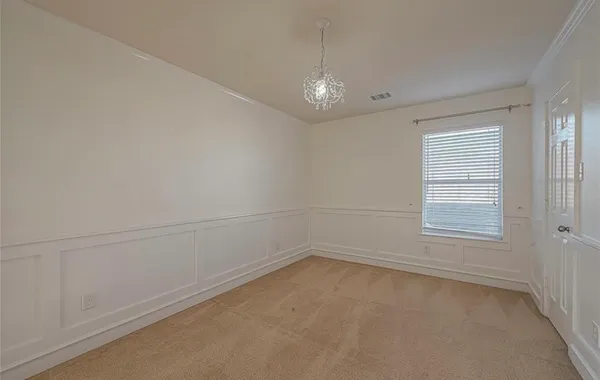 an empty room with a empty space and windows
