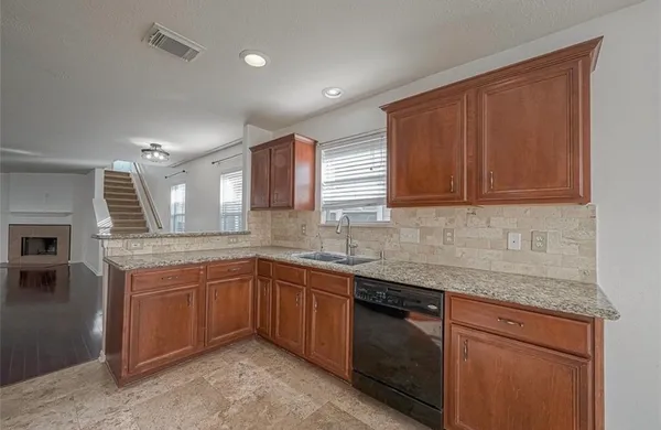 a kitchen with a sink and cabinets