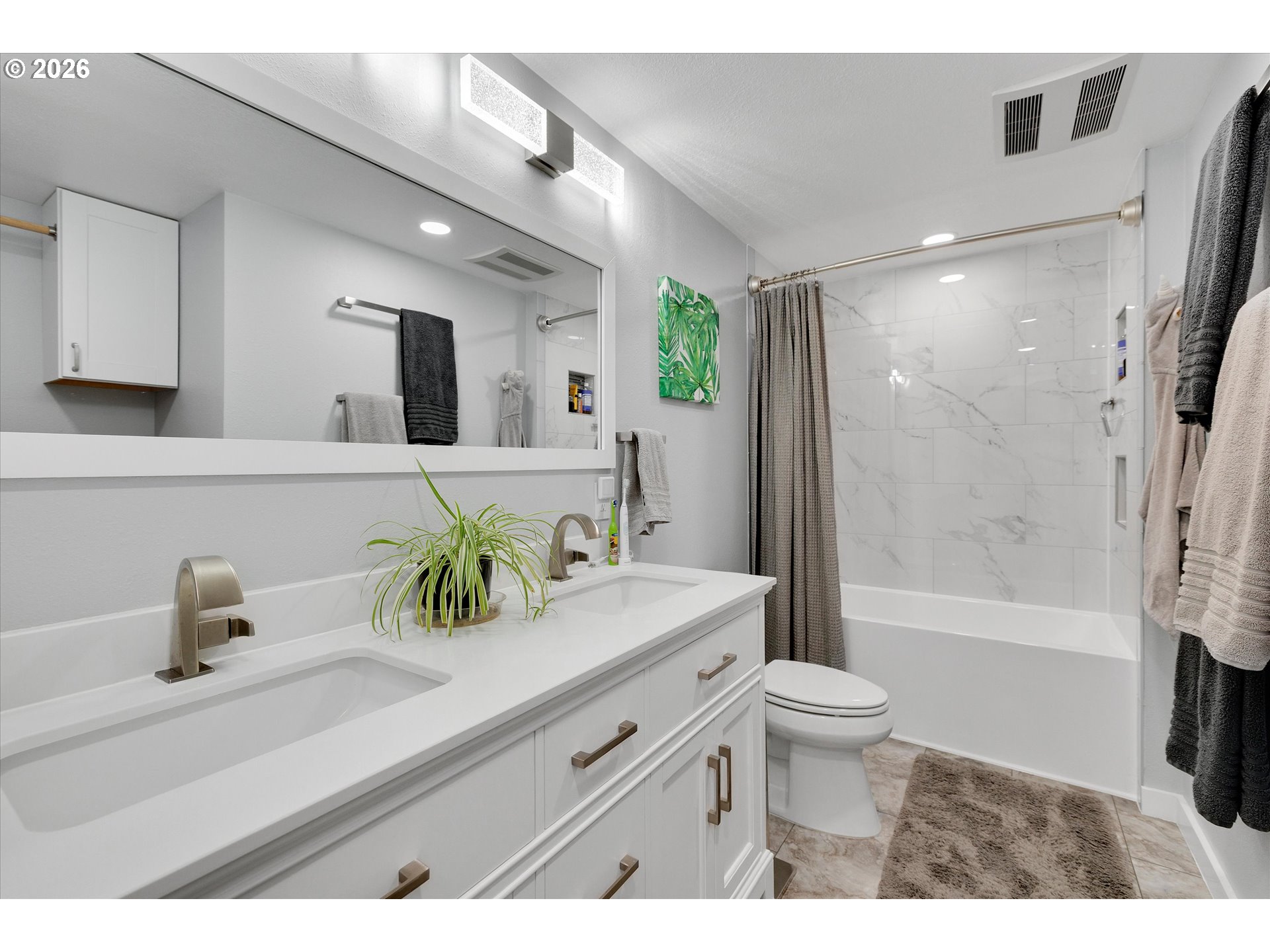 1144 North Pine Street Canby, OR 97013 - Photo 22 of 41 a bathroom with a sink a toilet and shower