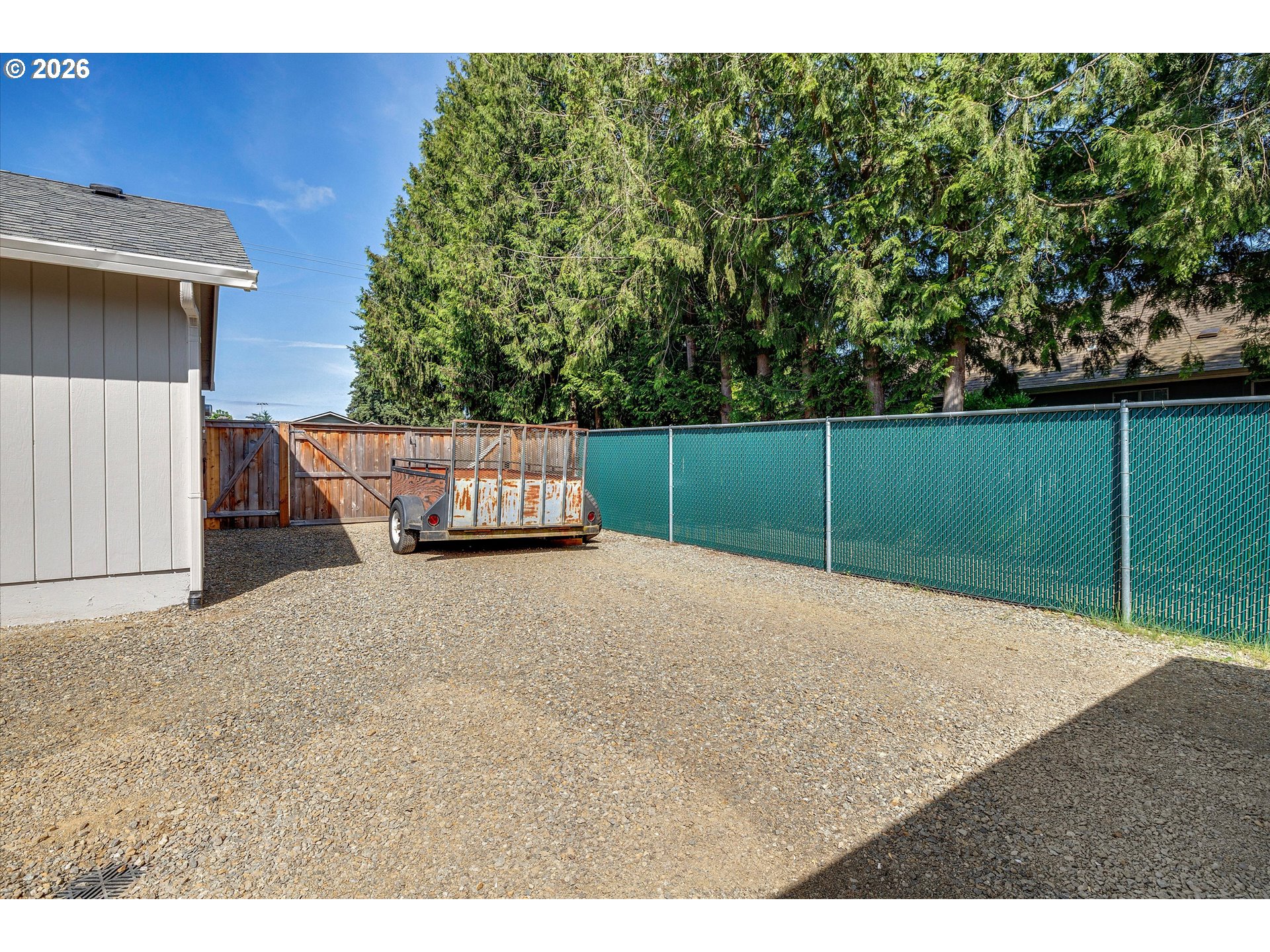 1144 North Pine Street Canby, OR 97013 - Photo 37 of 41 a backyard of a house with lots of green space