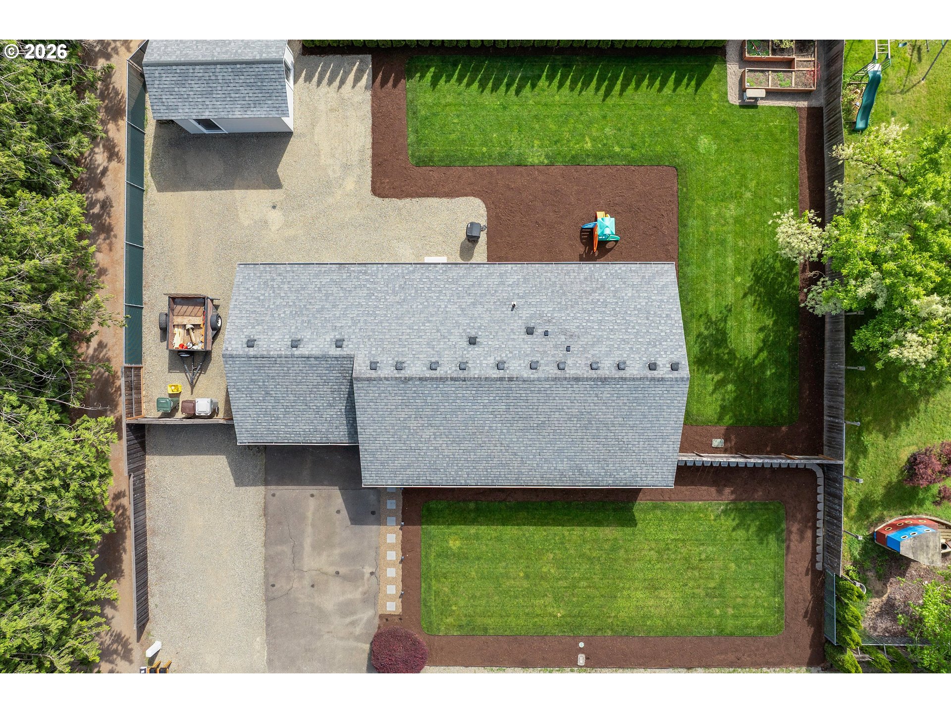 1144 North Pine Street Canby, OR 97013 - Photo 40 of 41 an aerial view of a house with a yard and a pool