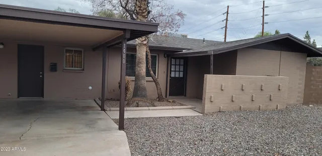 a view of a house with large windows