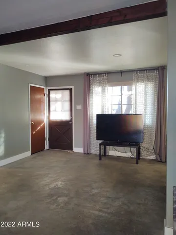 a view of livingroom with furniture and closet