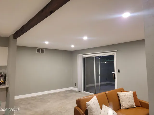 a view of an empty room with a window