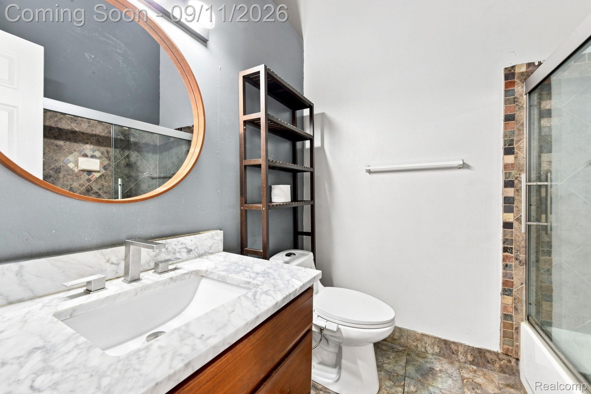 3201 Lynhurst Court Rochester, MI 48306 - Photo 23 of 43 White marble-finish countertop with an undermount sink and brushed nickel faucet