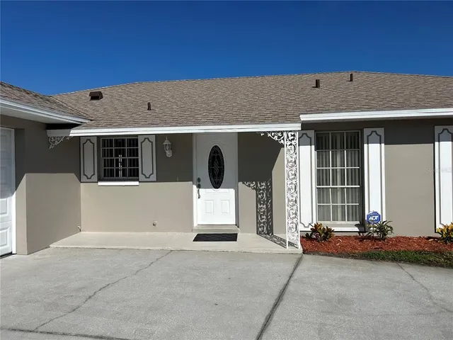 a view of a house with large windows