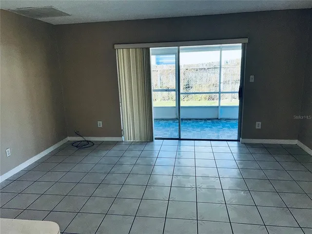 a view of an empty room and window