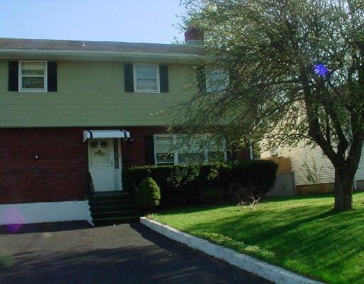 25 Harris Street Norwalk, CT 06850 - Photo 1 of 1 a front view of a house with garden