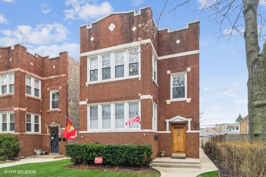 3935 North Christiana Avenue, Unit 2 Chicago, IL 60618 - Photo 1 of 12 front view of house with a yard