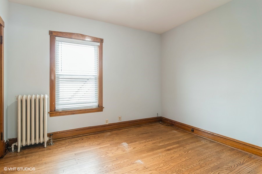 3935 North Christiana Avenue, Unit 2 Chicago, IL 60618 - Photo 5 of 12 an empty room with a window