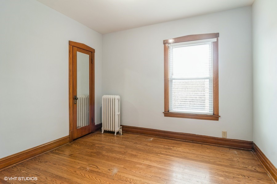 3935 North Christiana Avenue, Unit 2 Chicago, IL 60618 - Photo 9 of 12 an empty room with a window
