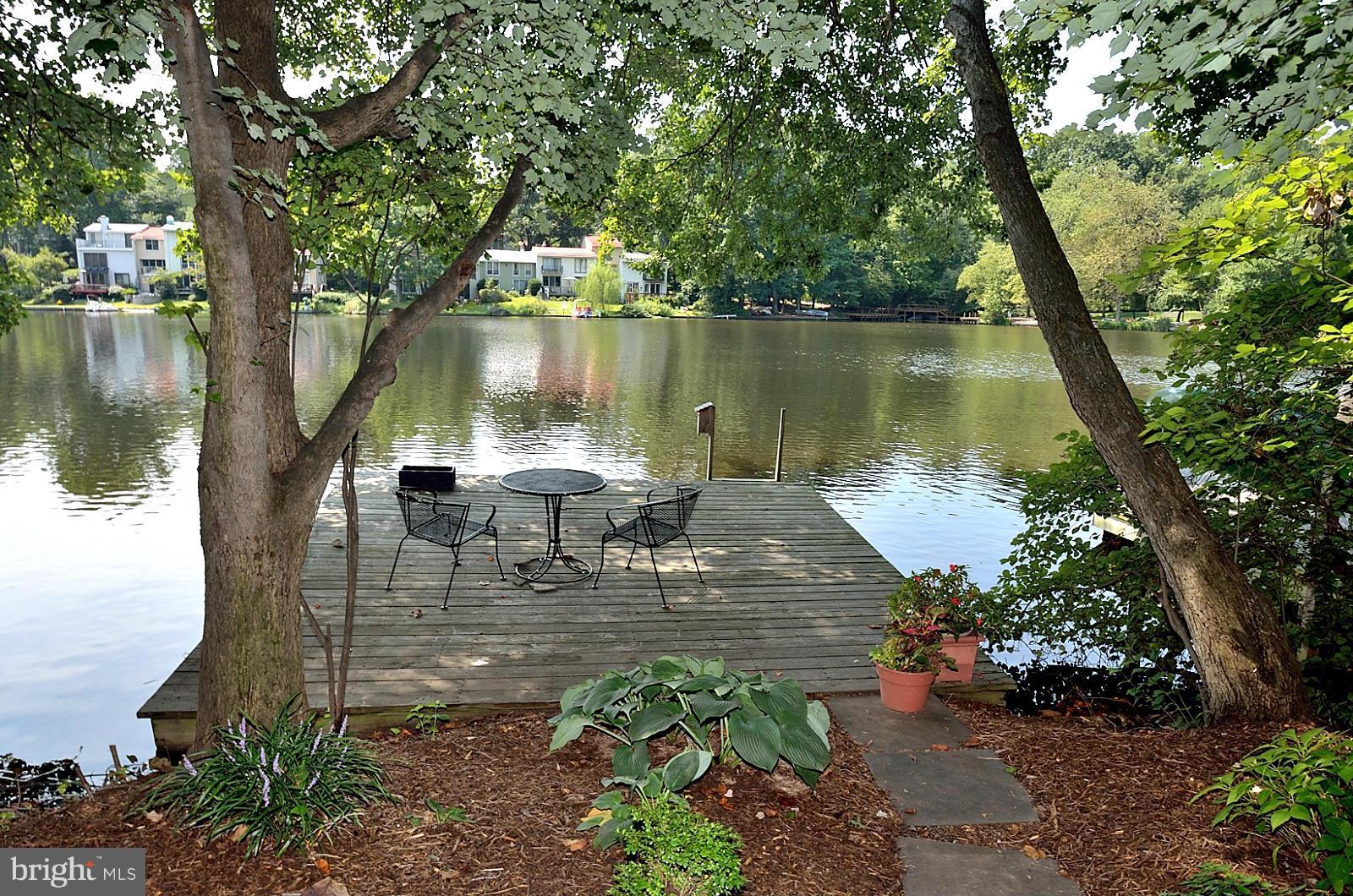 a lake view with sitting space and garden view