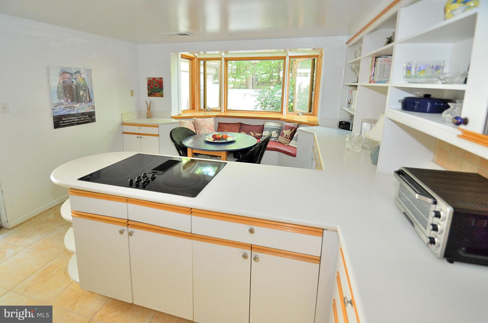 1602 Waters Edge Lane Reston, VA 20190 - Photo 14 of 28 a kitchen with stainless steel appliances granite countertop a sink a stove and a refrigerator