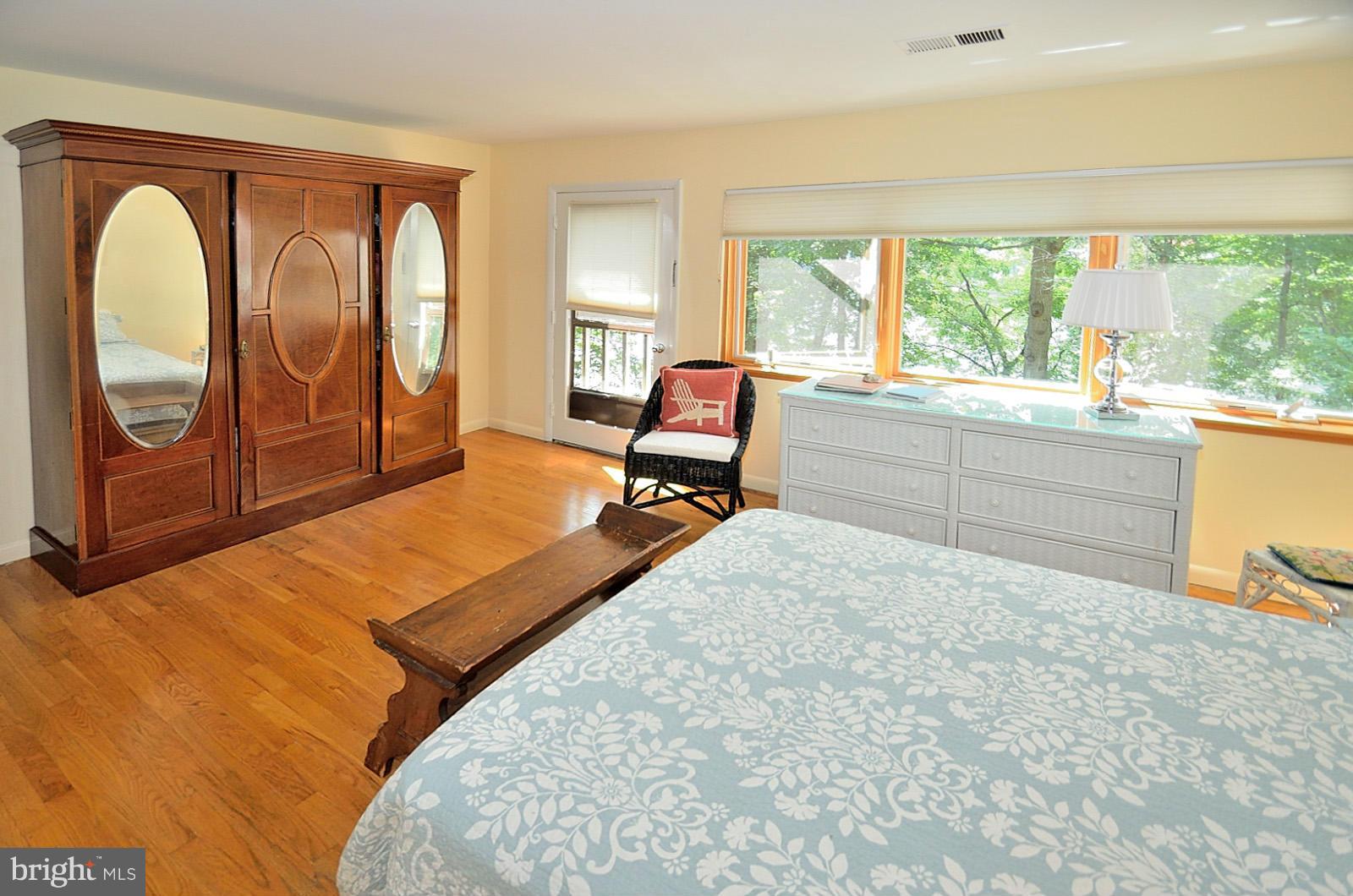 1602 Waters Edge Lane Reston, VA 20190 - Photo 19 of 28 a bedroom with a bed and large windows