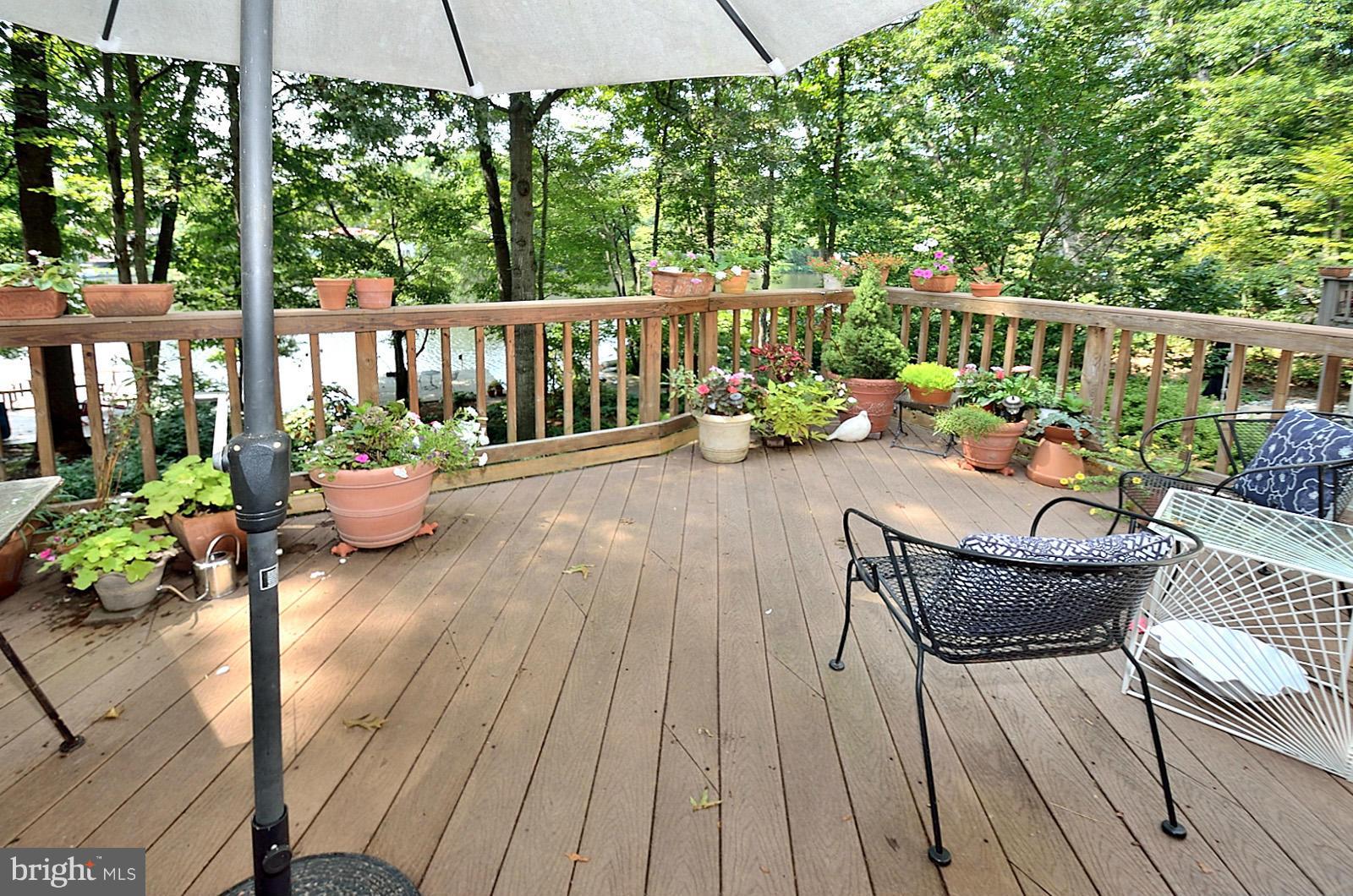 1602 Waters Edge Lane Reston, VA 20190 - Photo 3 of 28 a view of a porch with furniture and garden