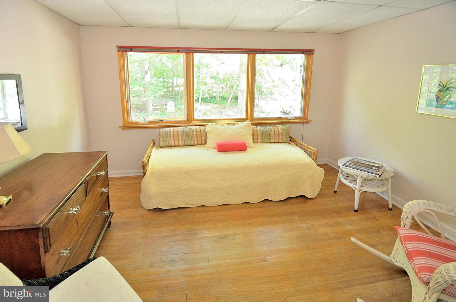 1602 Waters Edge Lane Reston, VA 20190 - Photo 21 of 28 a bedroom with a bed and wooden floor