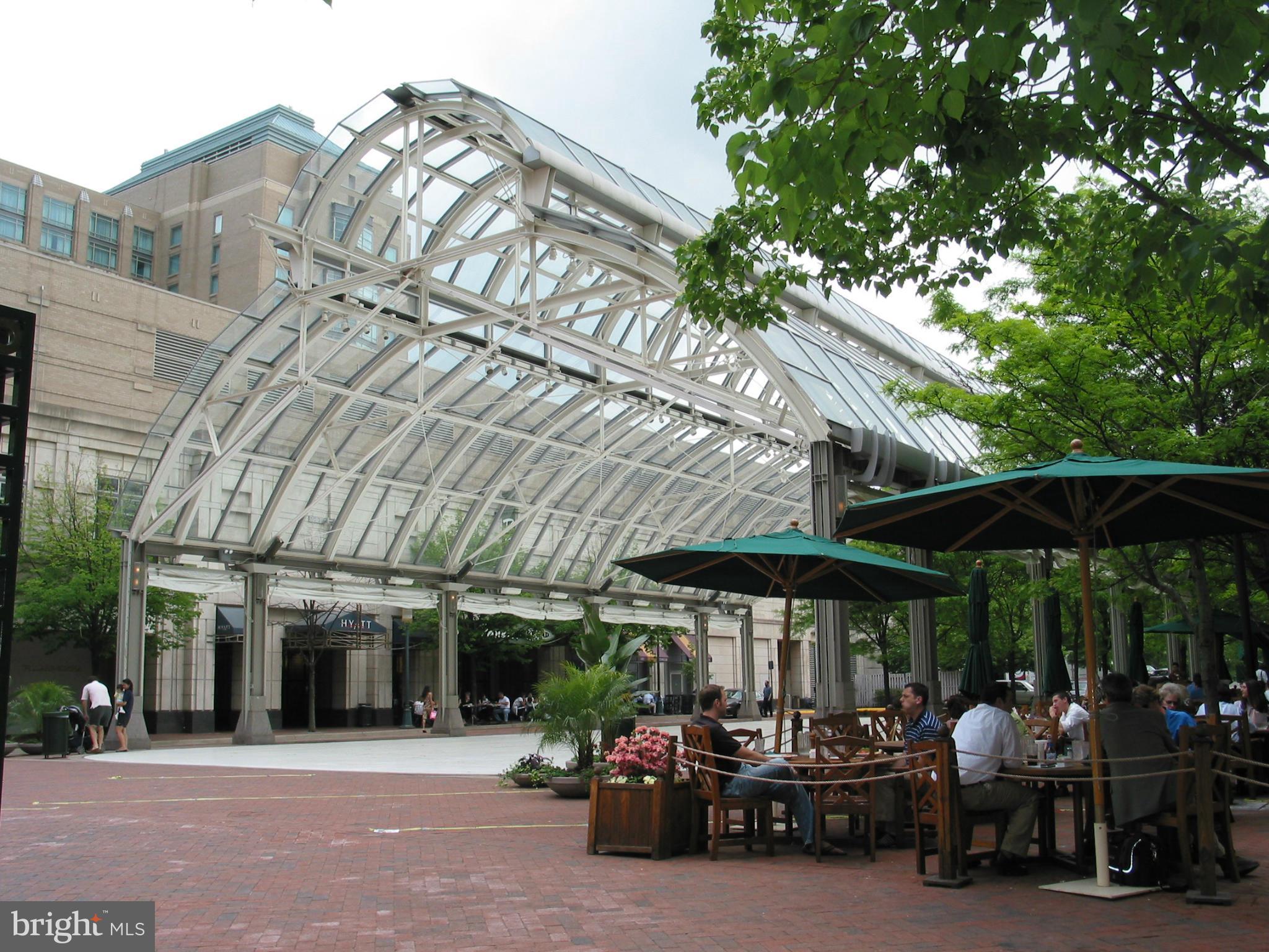 1602 Waters Edge Lane Reston, VA 20190 - Photo 26 of 28 a view of a patio with table and chairs under an umbrella