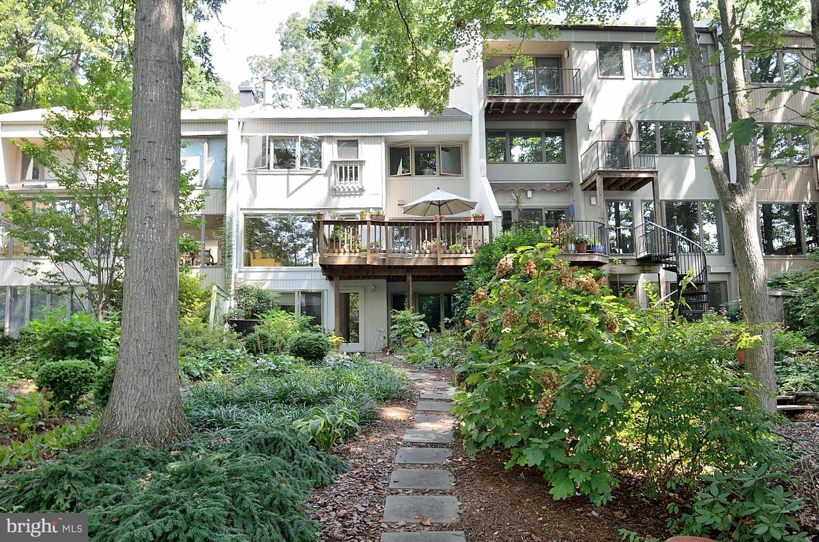 1602 Waters Edge Lane Reston, VA 20190 - Photo 5 of 28 a front view of a house with garden