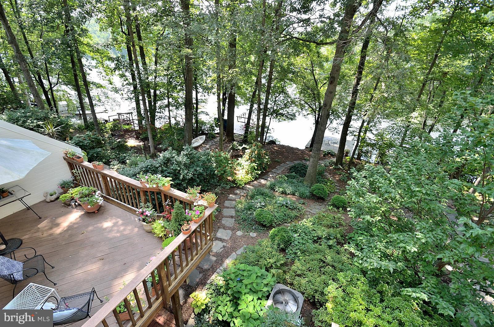 1602 Waters Edge Lane Reston, VA 20190 - Photo 10 of 28 a view of a yard with plants and trees
