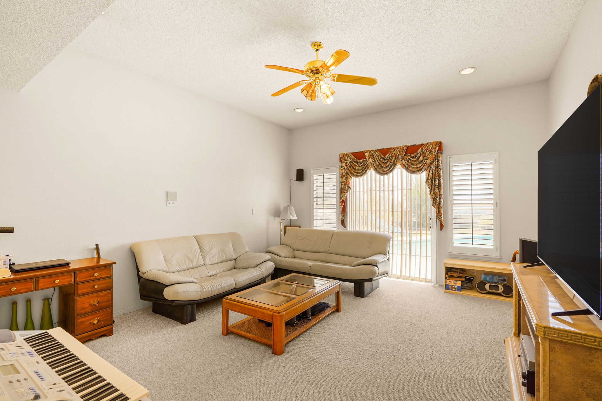 6574 Eagle Ridge Drive El Paso, TX 79912 - Photo 12 of 50 a living room with furniture and a flat screen tv