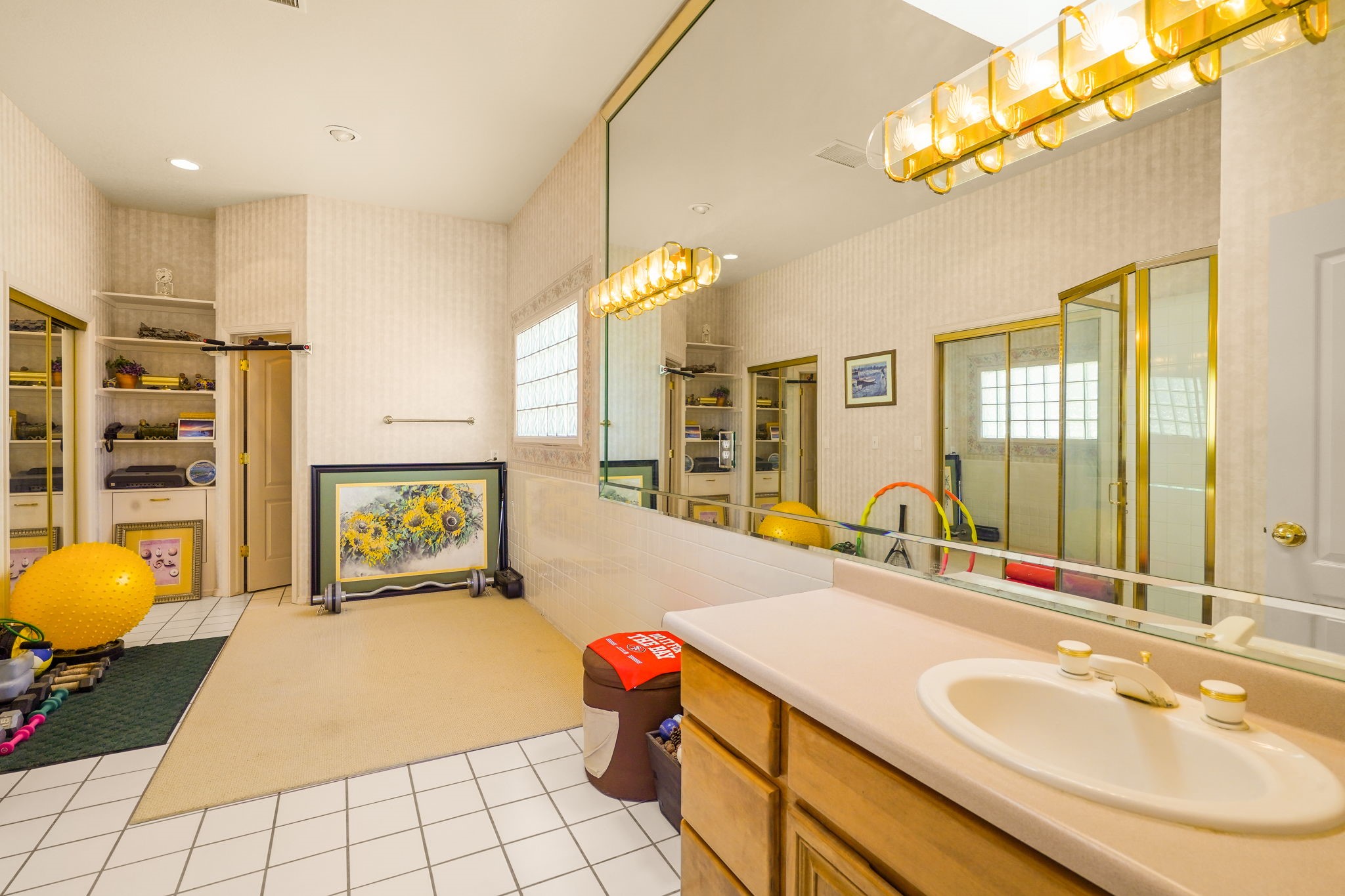 6574 Eagle Ridge Drive El Paso, TX 79912 - Photo 14 of 50 a en suite bathroom with a granite countertop sink a mirror and a shower
