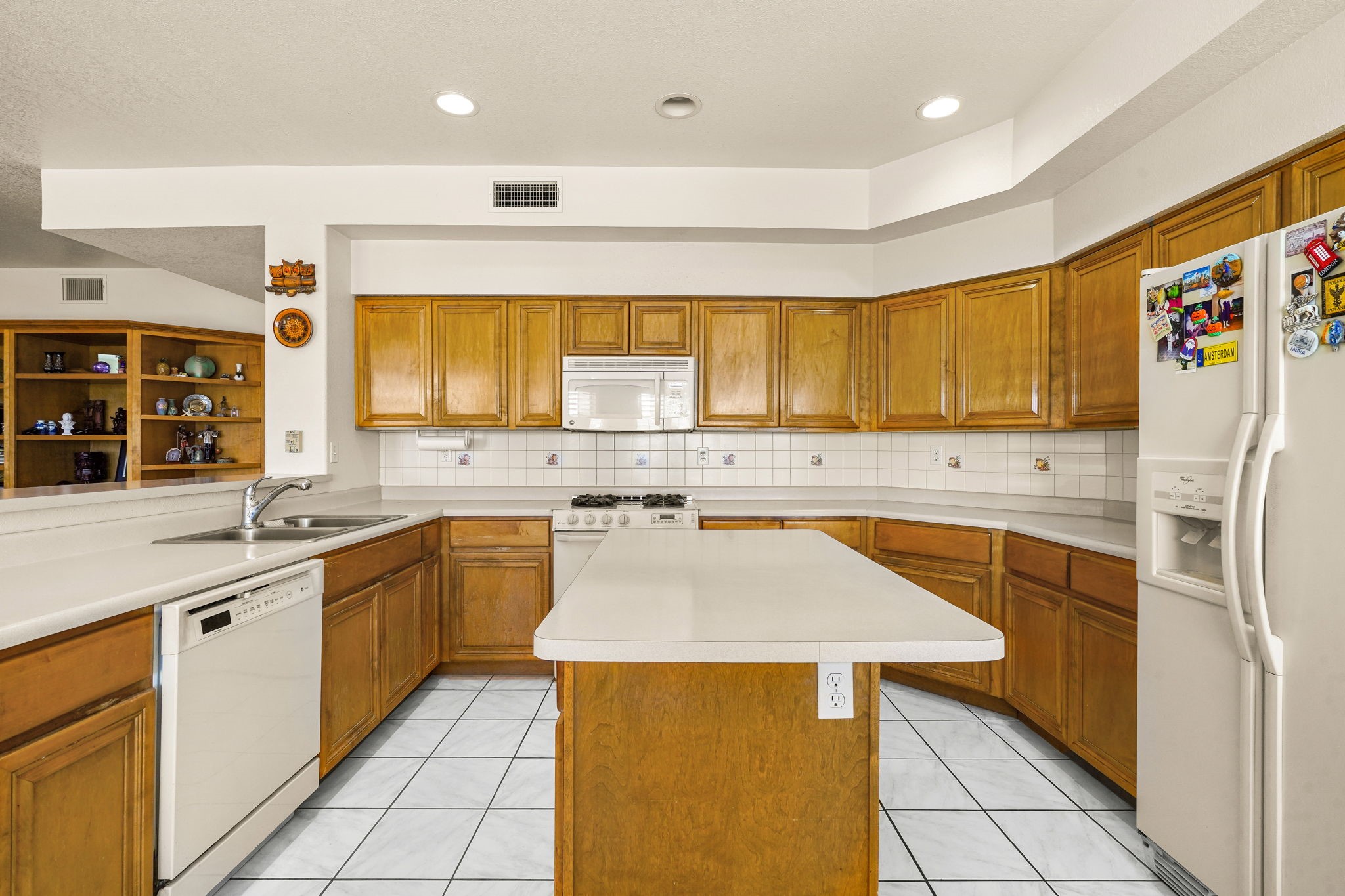 6574 Eagle Ridge Drive El Paso, TX 79912 - Photo 20 of 50 a kitchen with stainless steel appliances granite countertop a sink and a stove
