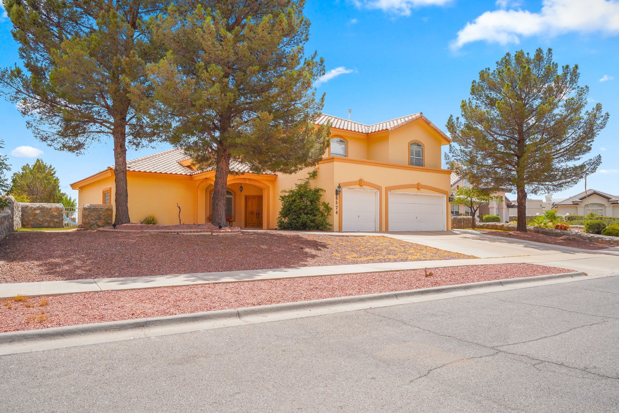 6574 Eagle Ridge Drive El Paso, TX 79912 - Photo 2 of 50 a view of road with large trees