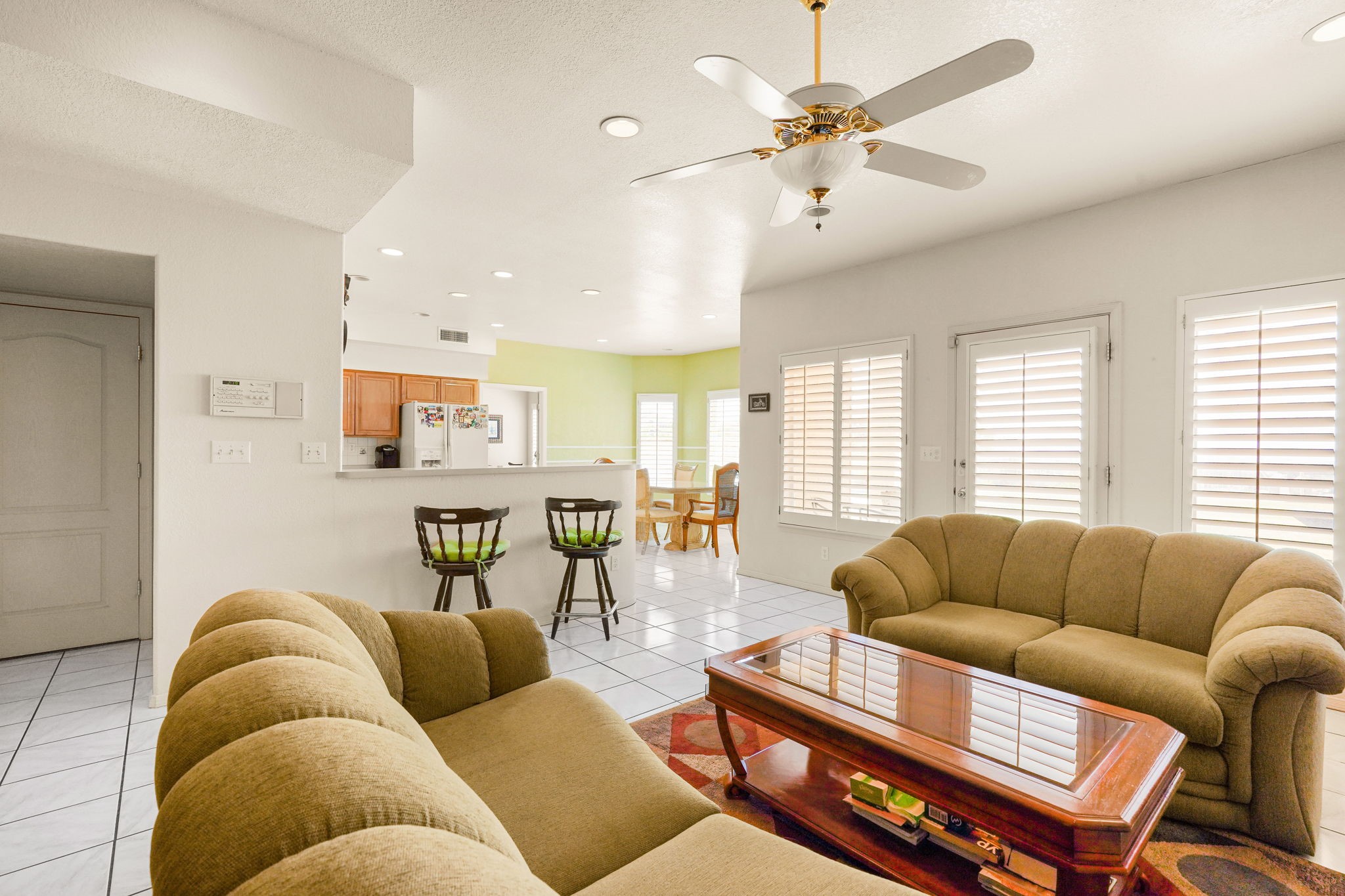 6574 Eagle Ridge Drive El Paso, TX 79912 - Photo 24 of 50 a living room with furniture ceiling fan and a wooden floor