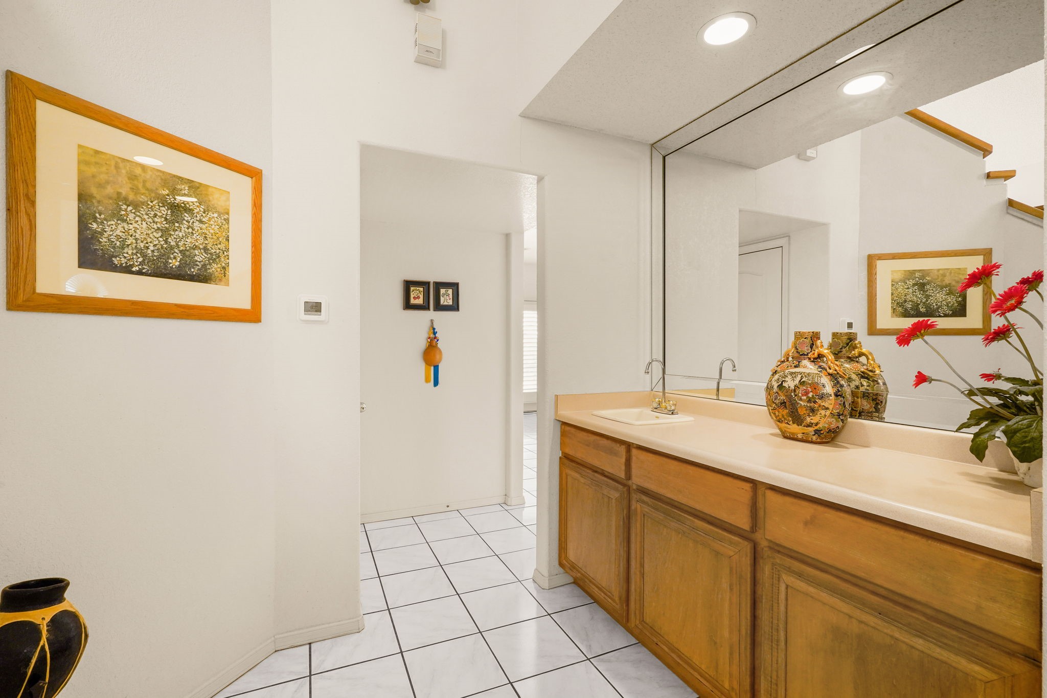 6574 Eagle Ridge Drive El Paso, TX 79912 - Photo 25 of 50 a bathroom with a sink and a mirror
